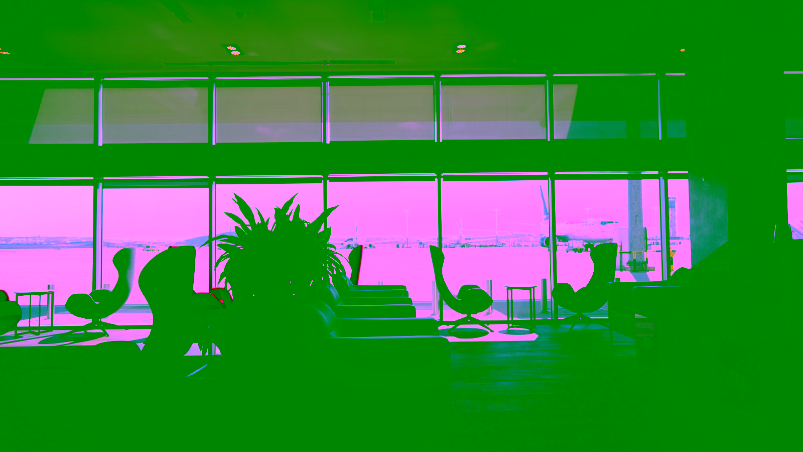 Airport lounge with airplane view.