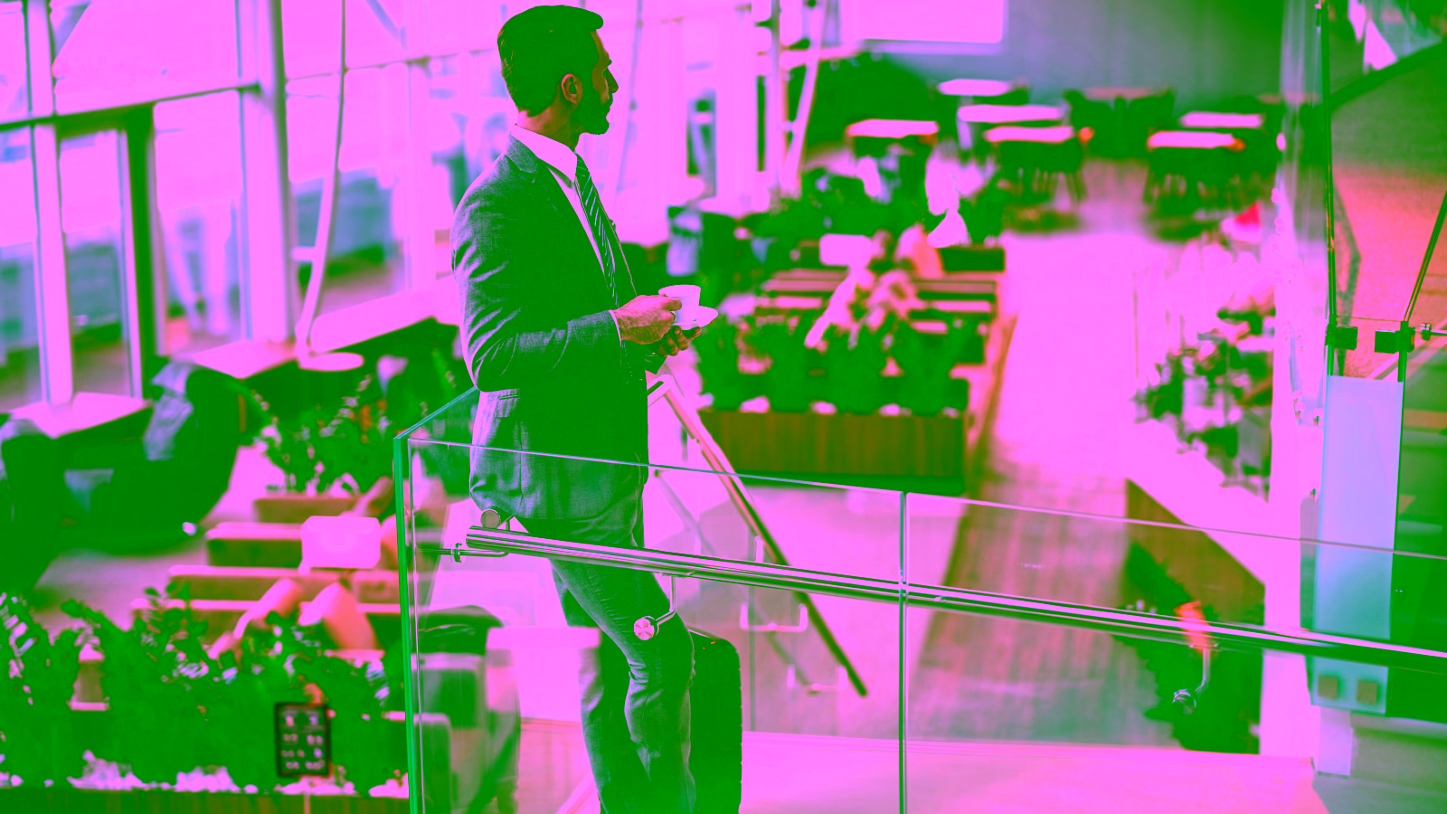 Businessman walking through an airport with luggage