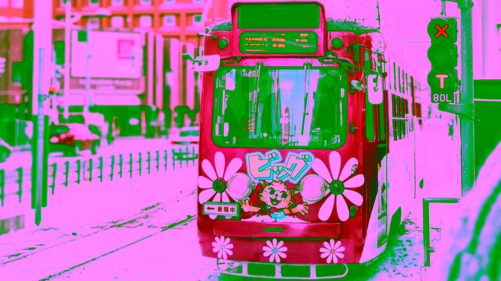 Pink tram on a snowy city street
