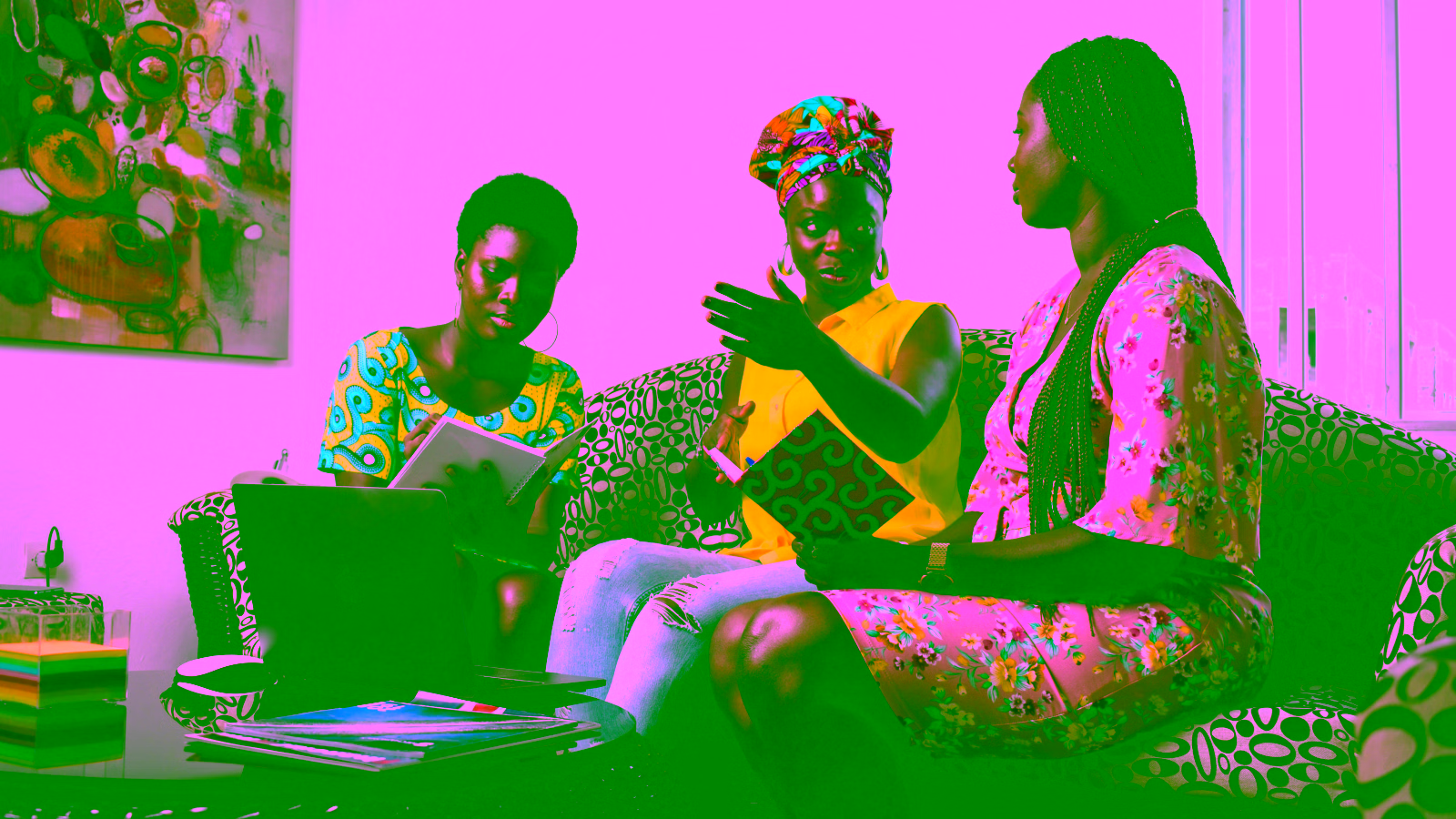 Three women collaborating with a laptop