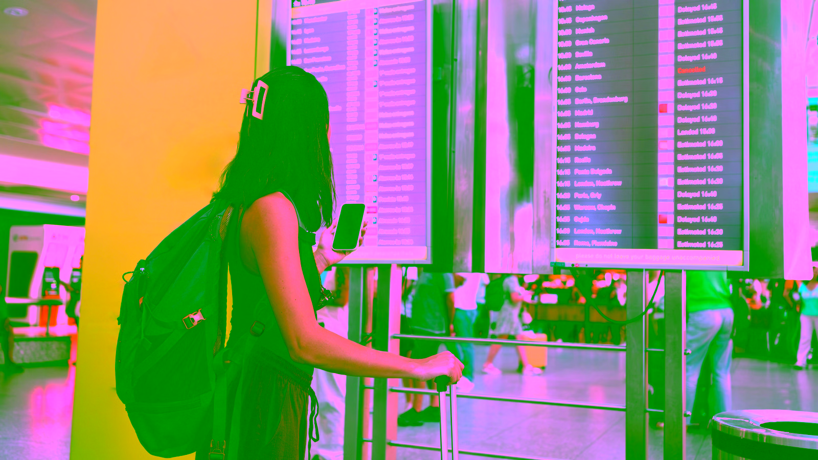 Traveler checking an airport departure board