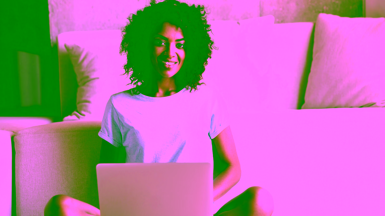 Woman using a laptop on a couch