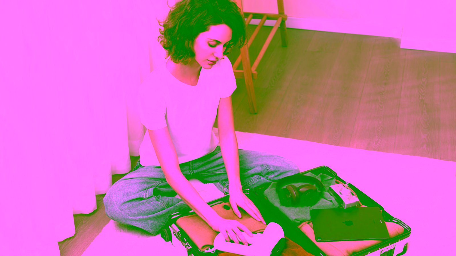 Woman packing suitcase for travel
