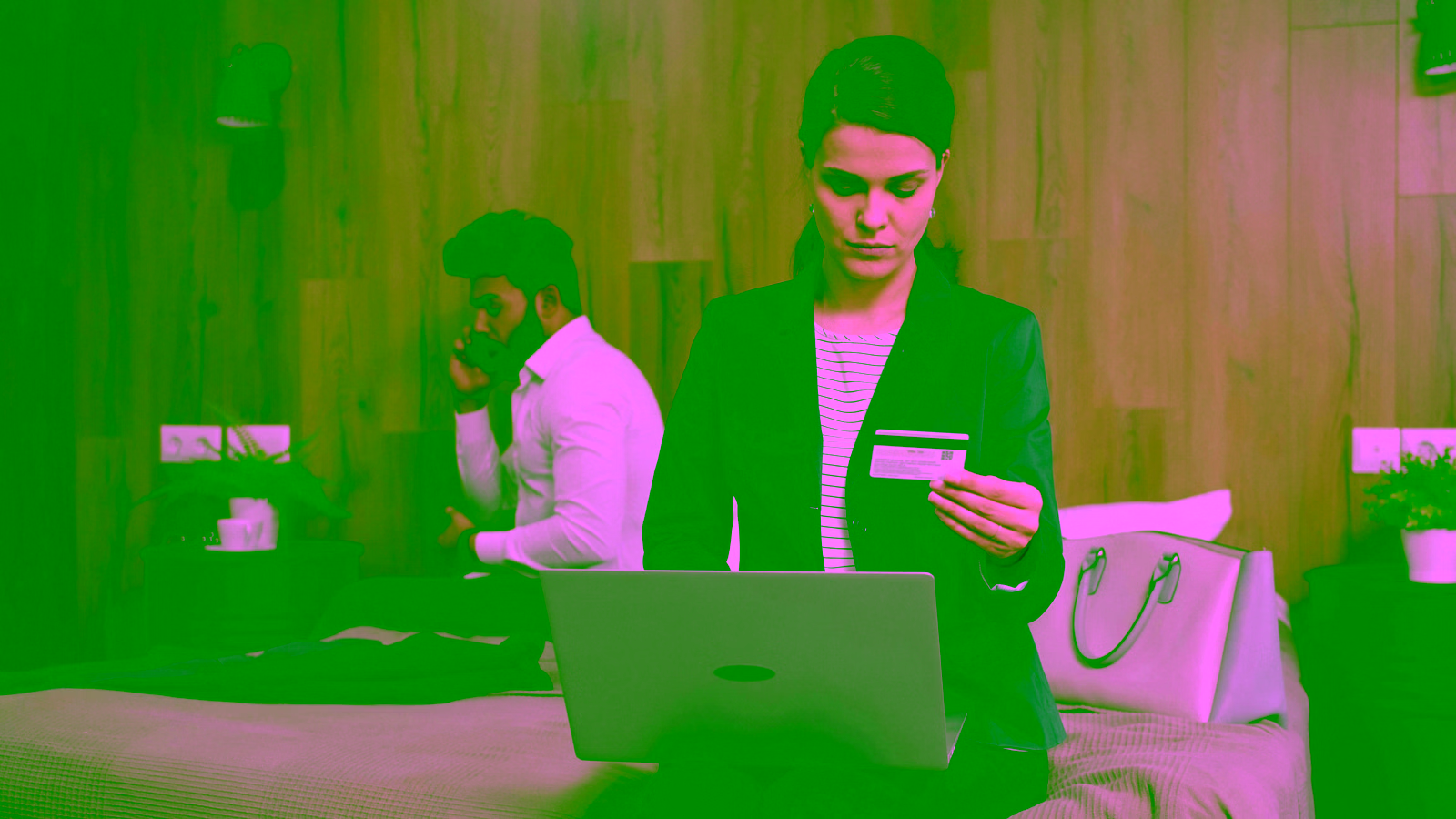 Woman using laptop with credit card