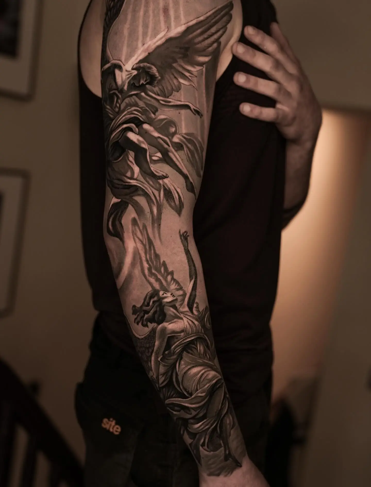 Large arm piece — black & grey realism