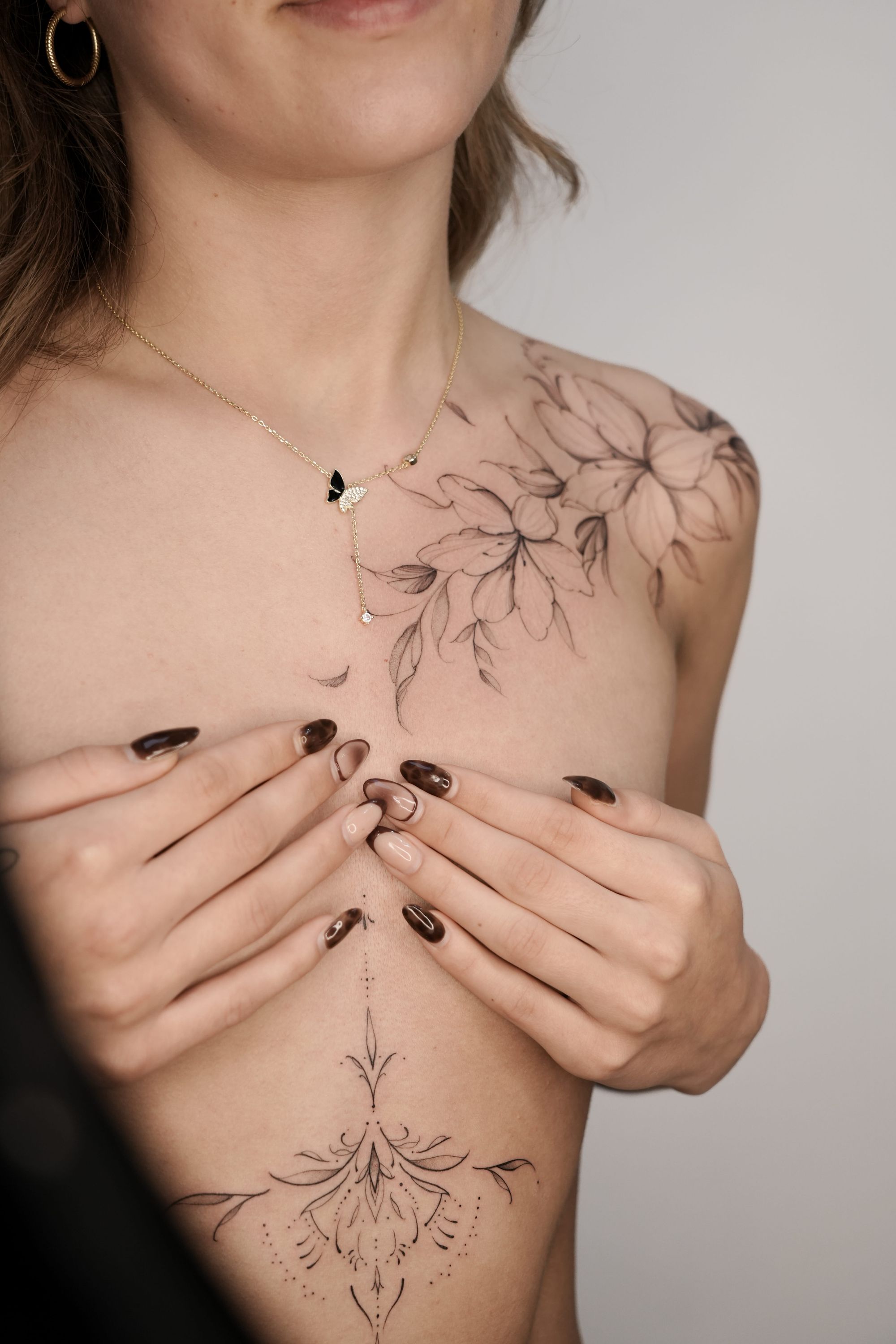 Fine line floral tattoo