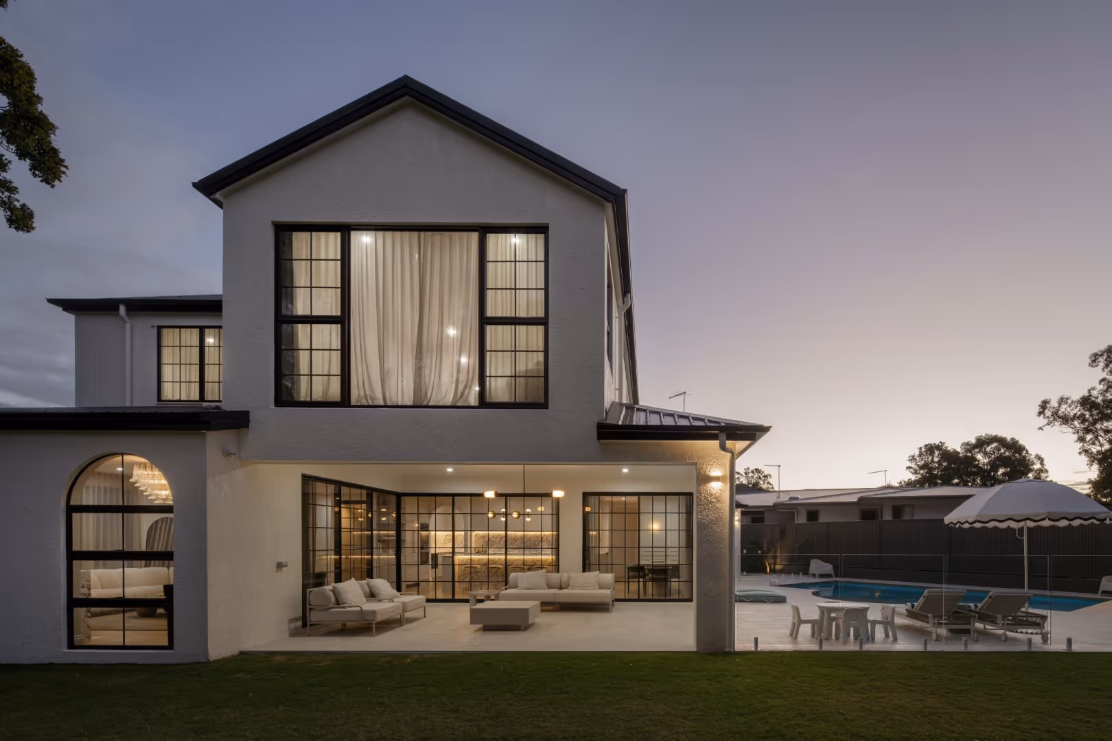 white house, marble table next to pool