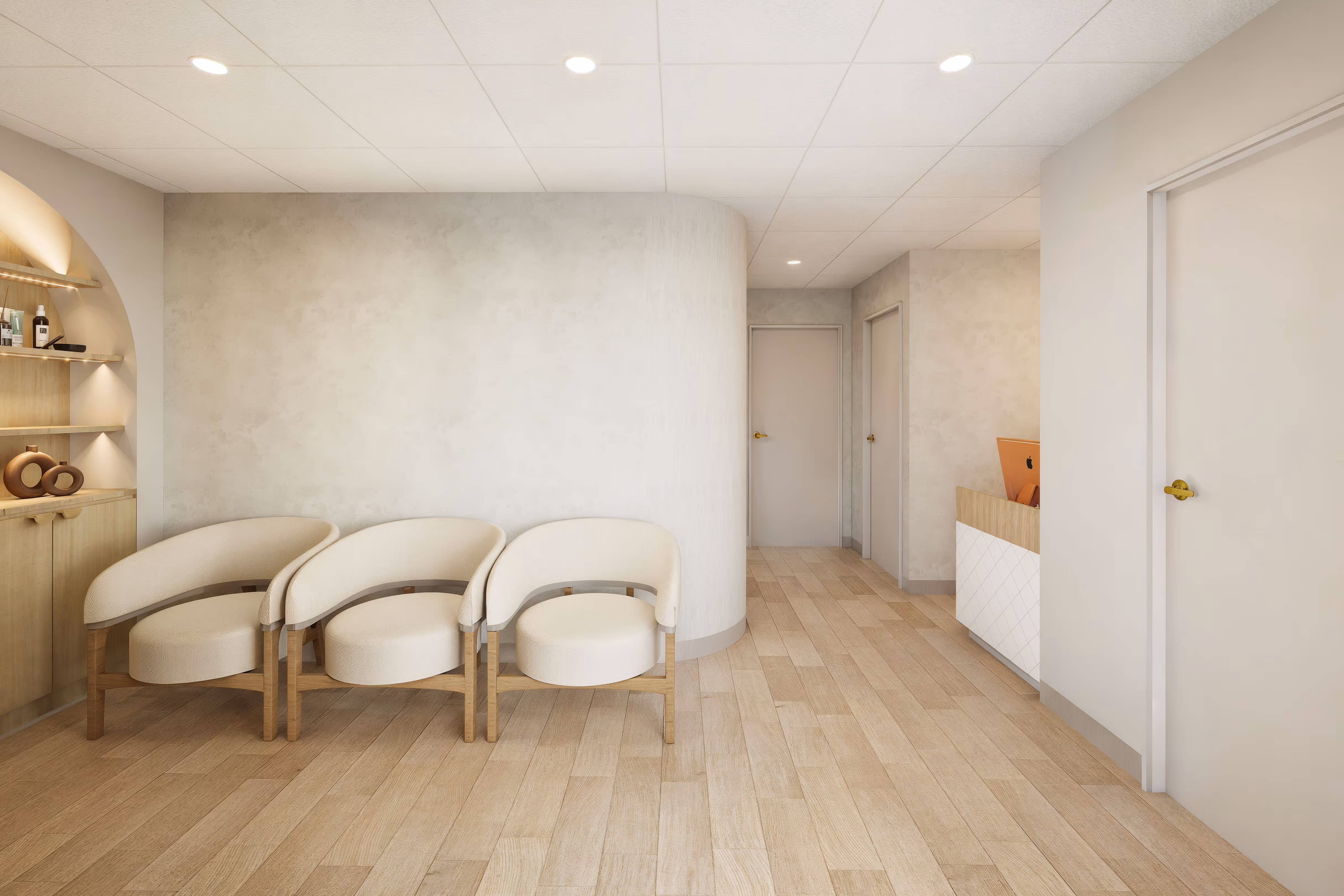 Modern waiting area with three cream-colored chairs, wooden floor, curved wall, and a small reception desk with an orange computer.