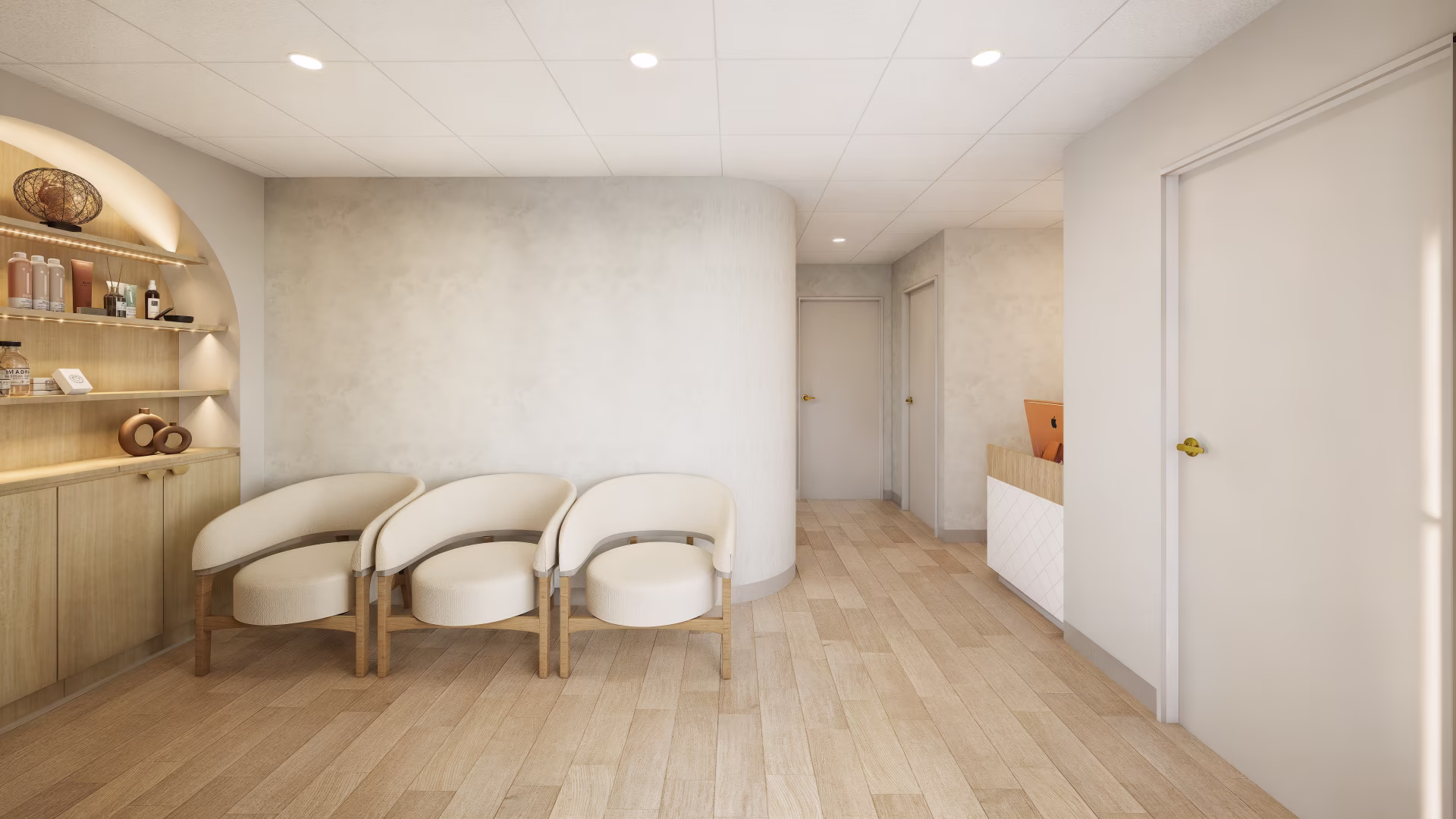 Minimalist waiting area with three cream armchairs, wood-paneled shelves with decor and products, and white walls and doors.