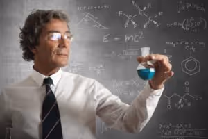 Academic Scientist Marvels At Blue Chemical Reaction Near Chalkboard