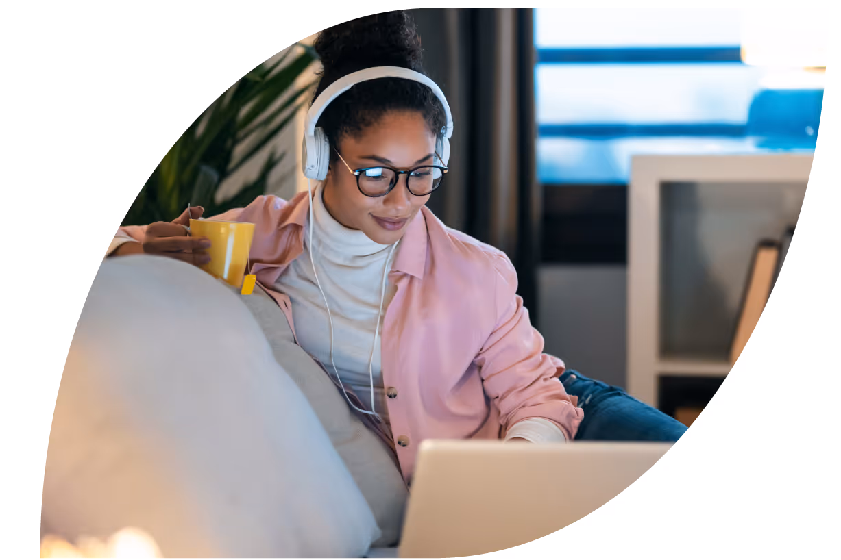 Image of woman with headphones and her laptop 