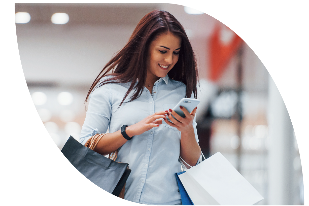 Image of woman with shopping bags looking at home