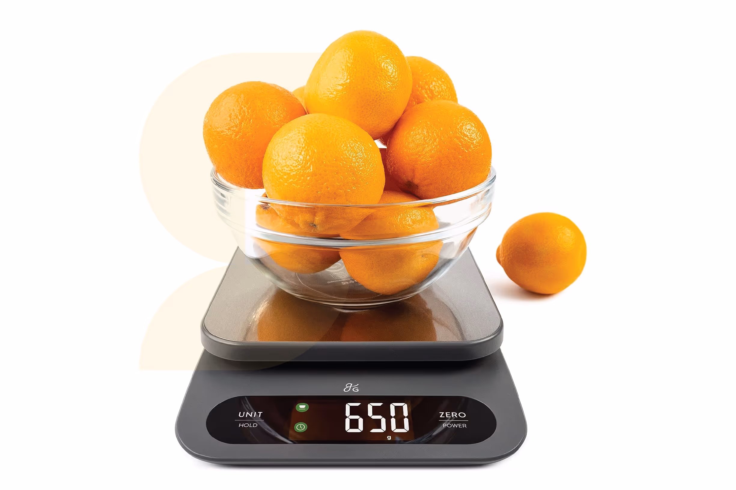 Oranges in a bowl on a food scale