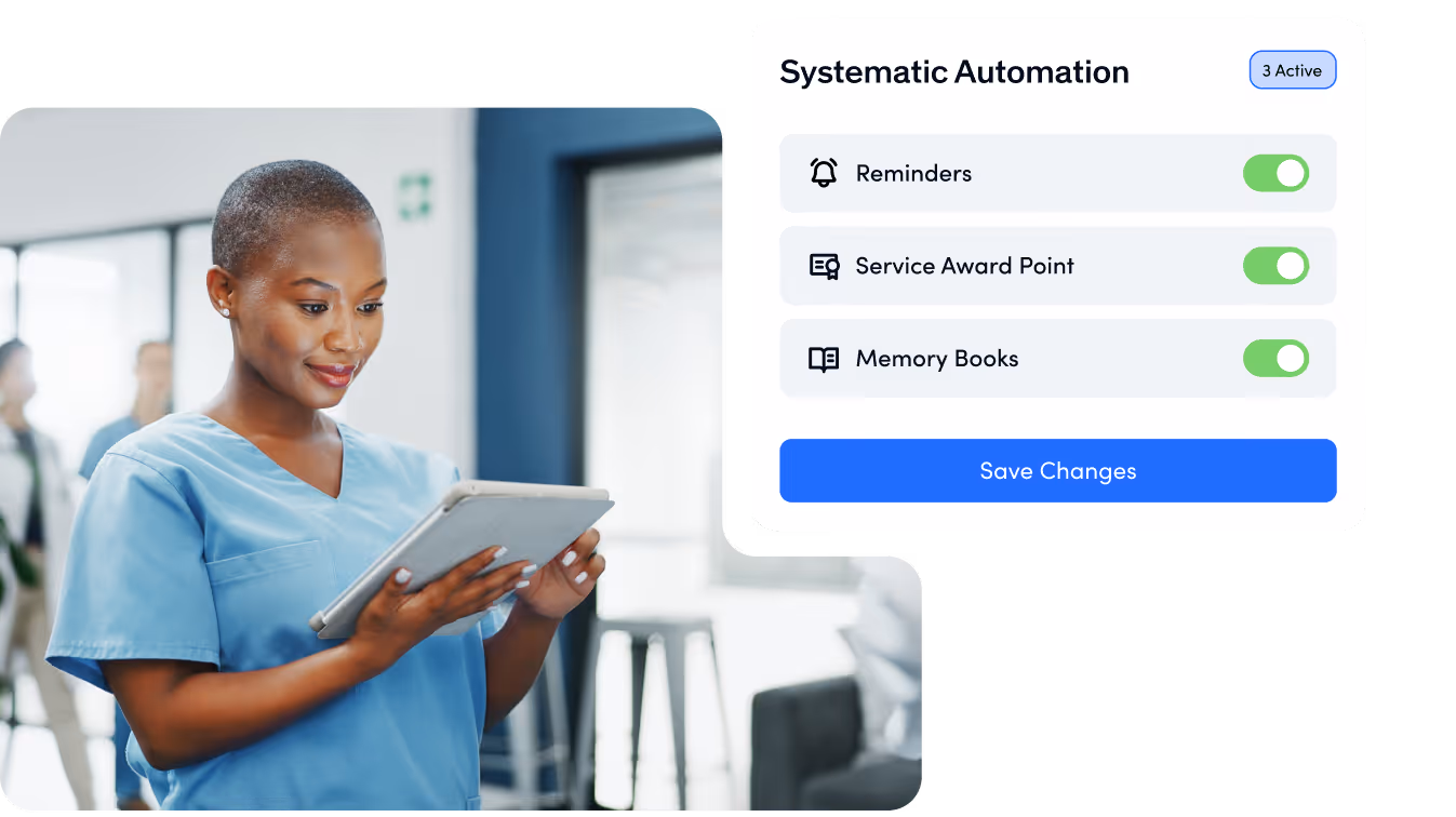 Employee in healthcare looking at tablet with automations for reminders and service awards