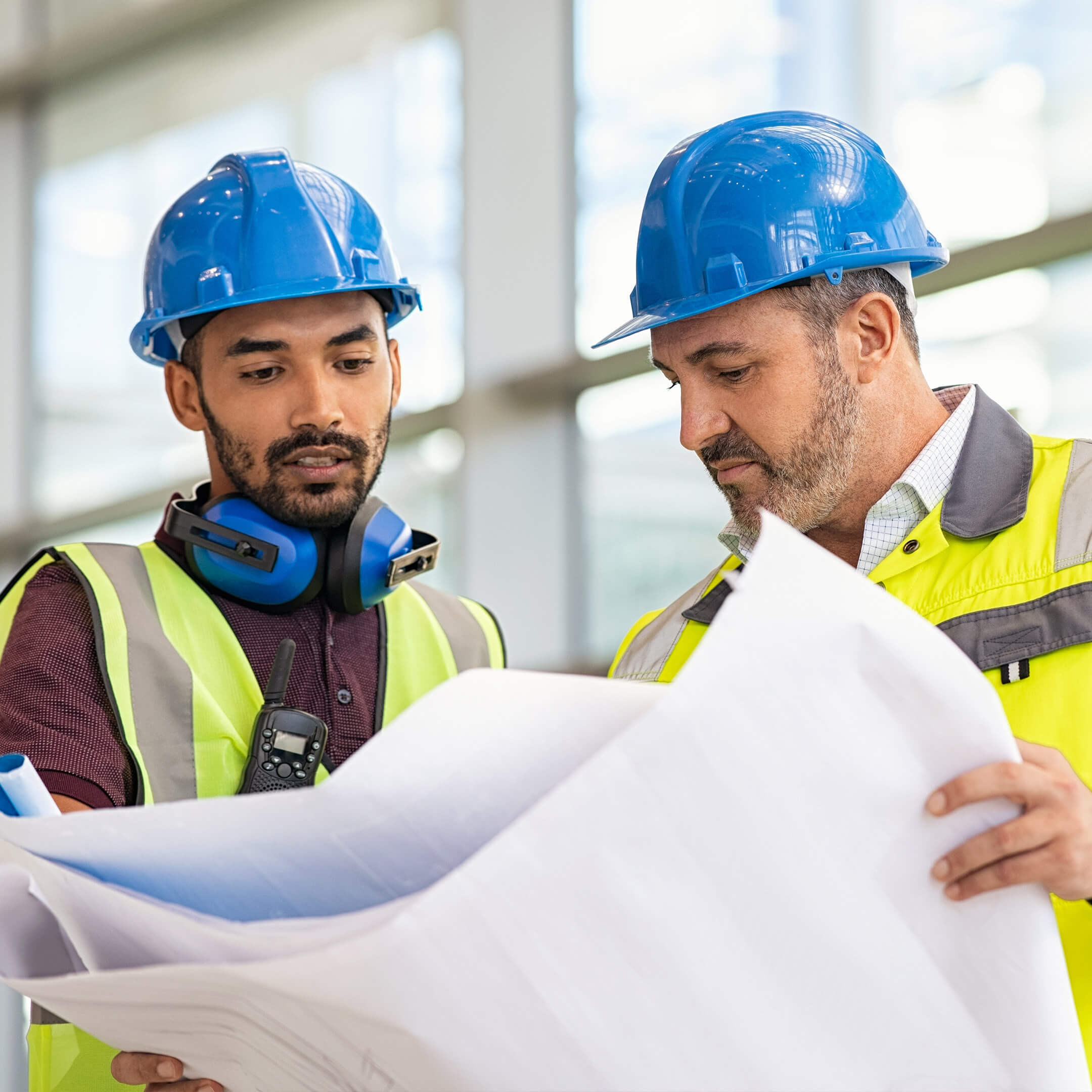 Two construction workers talkign to eachother