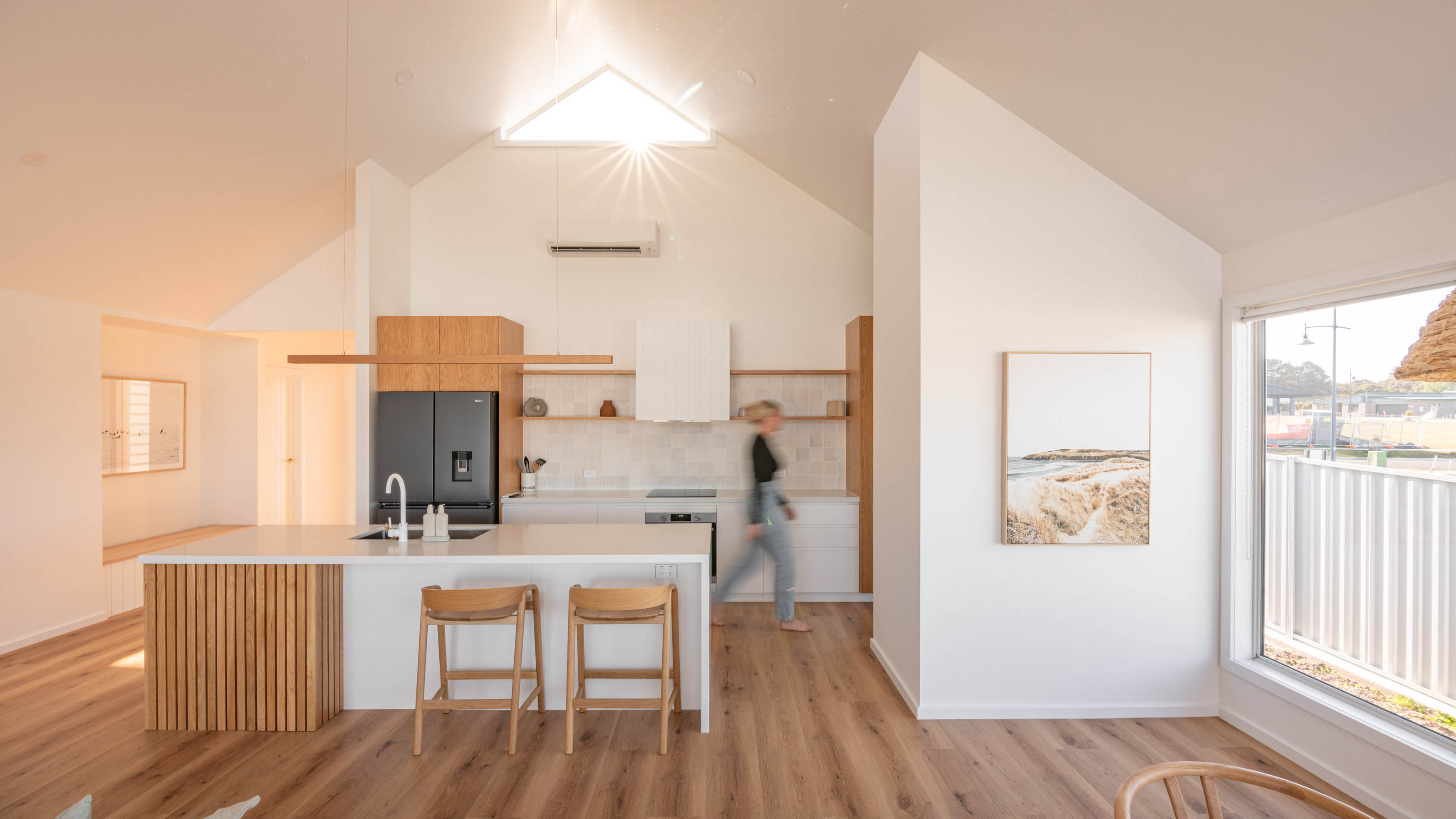 External image with of a white coloured house with a nice sunset.