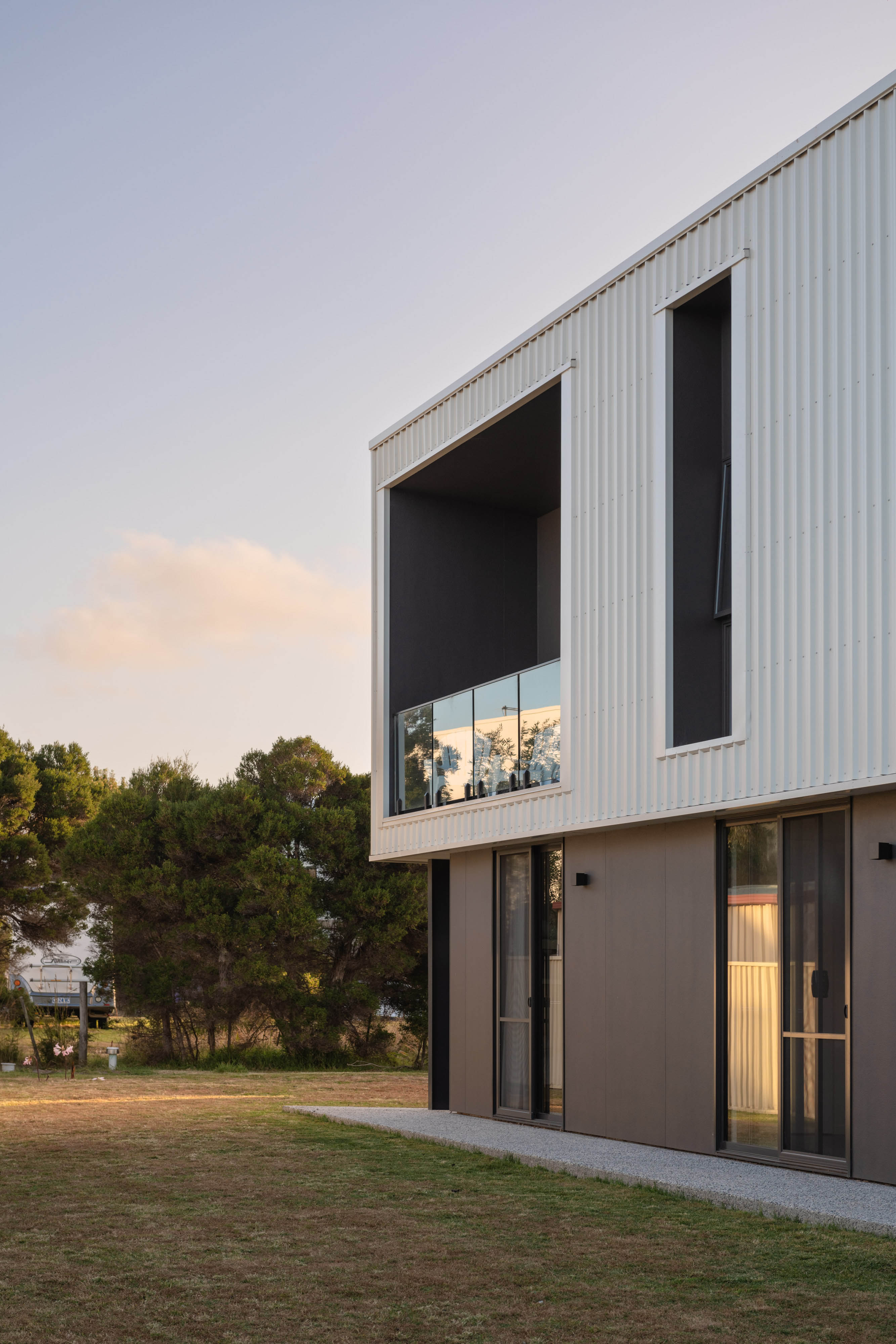 External image with of a white and dark grey coloured house.