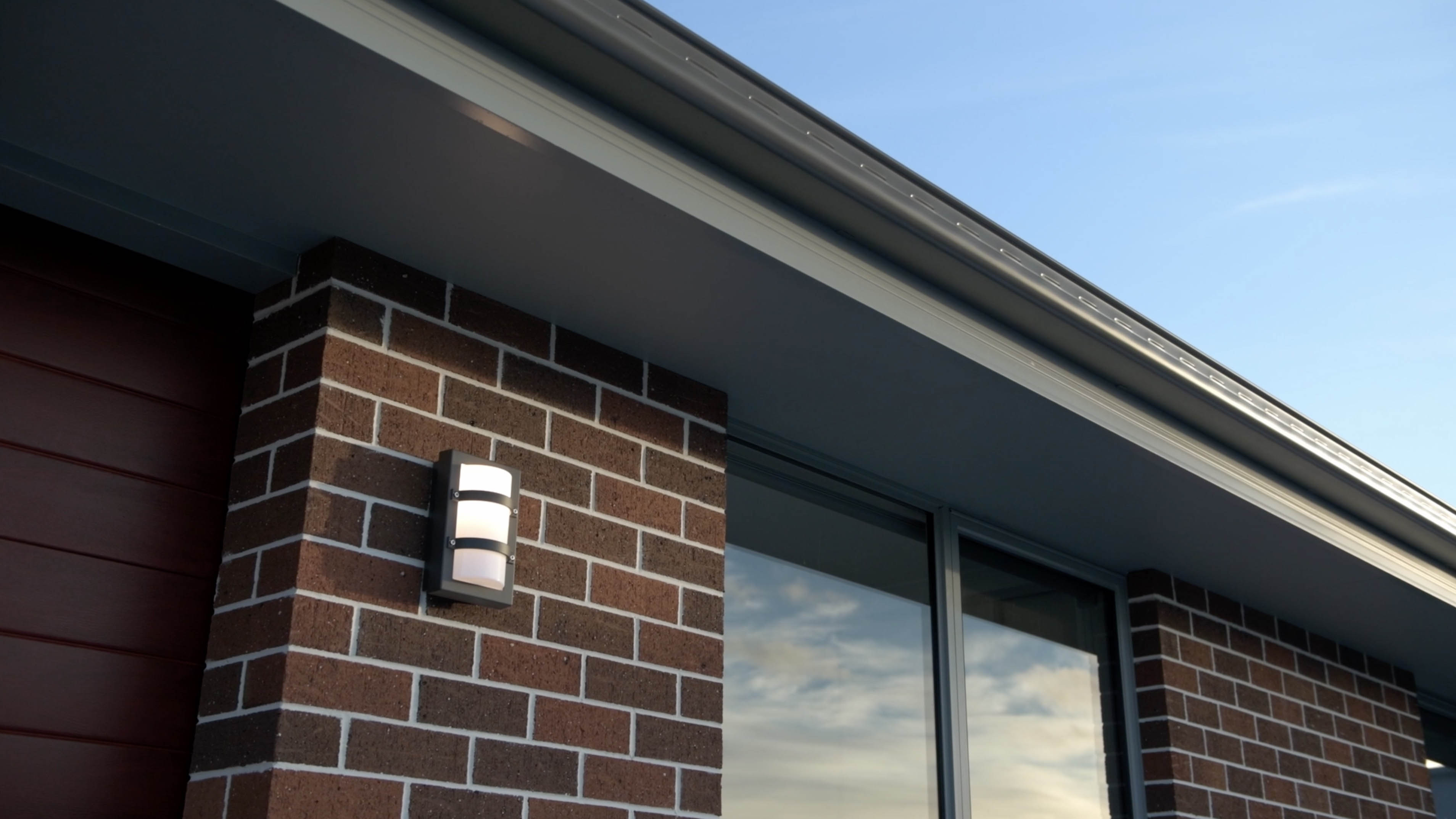 External image with of a white coloured house with a nice sunset.