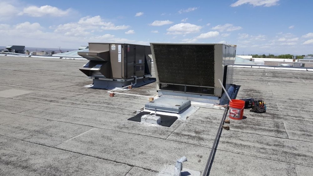 Commercial HVAC services in Albuquerque, NM rooftop inspection.
