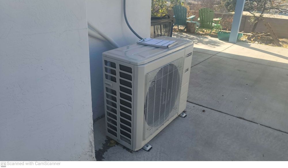 AC repair in Albuquerque, NM diagnosing condenser unit.