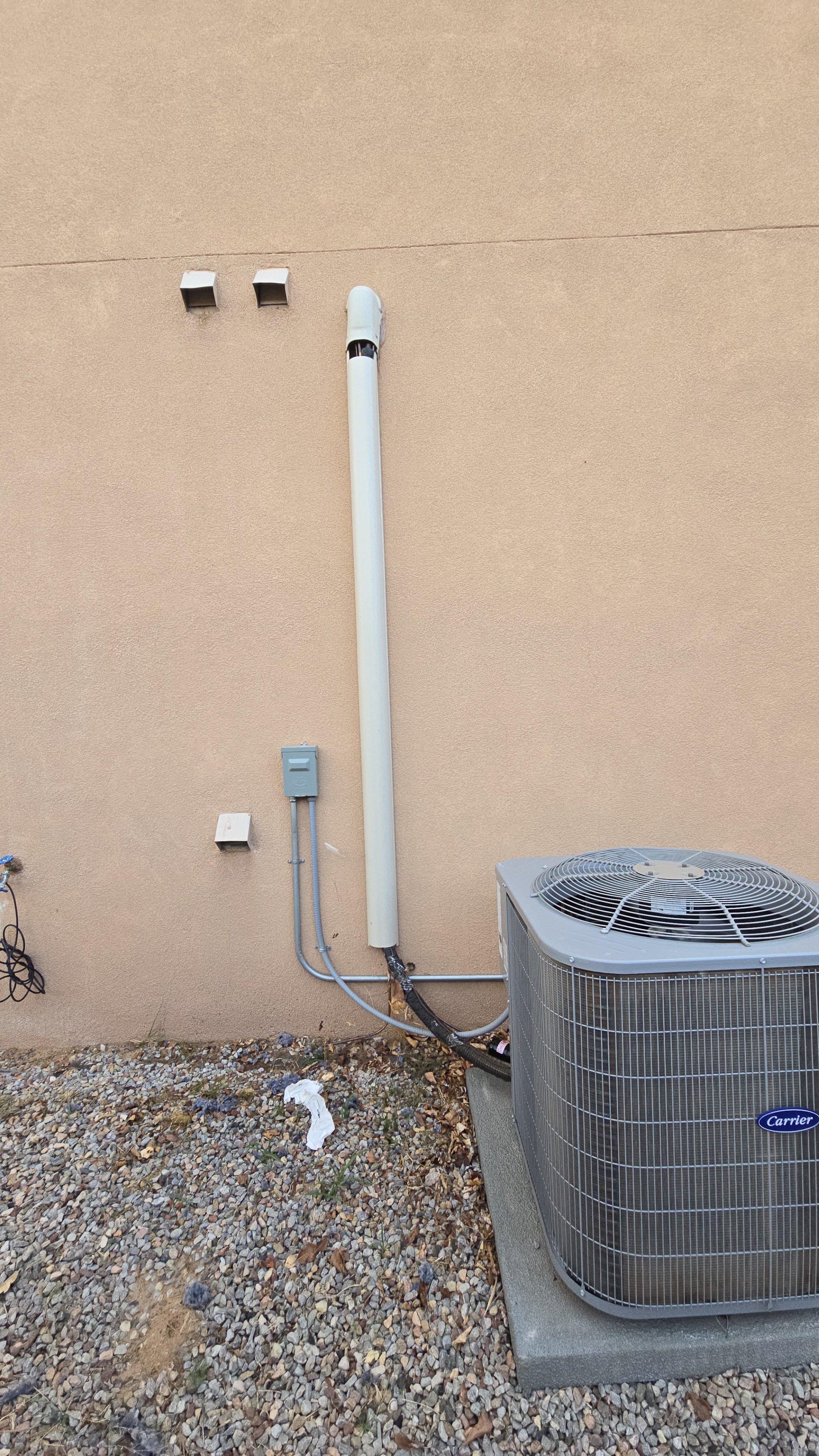 AC repair in North Easterns Albuquerque, NM Carrier unit inspection.