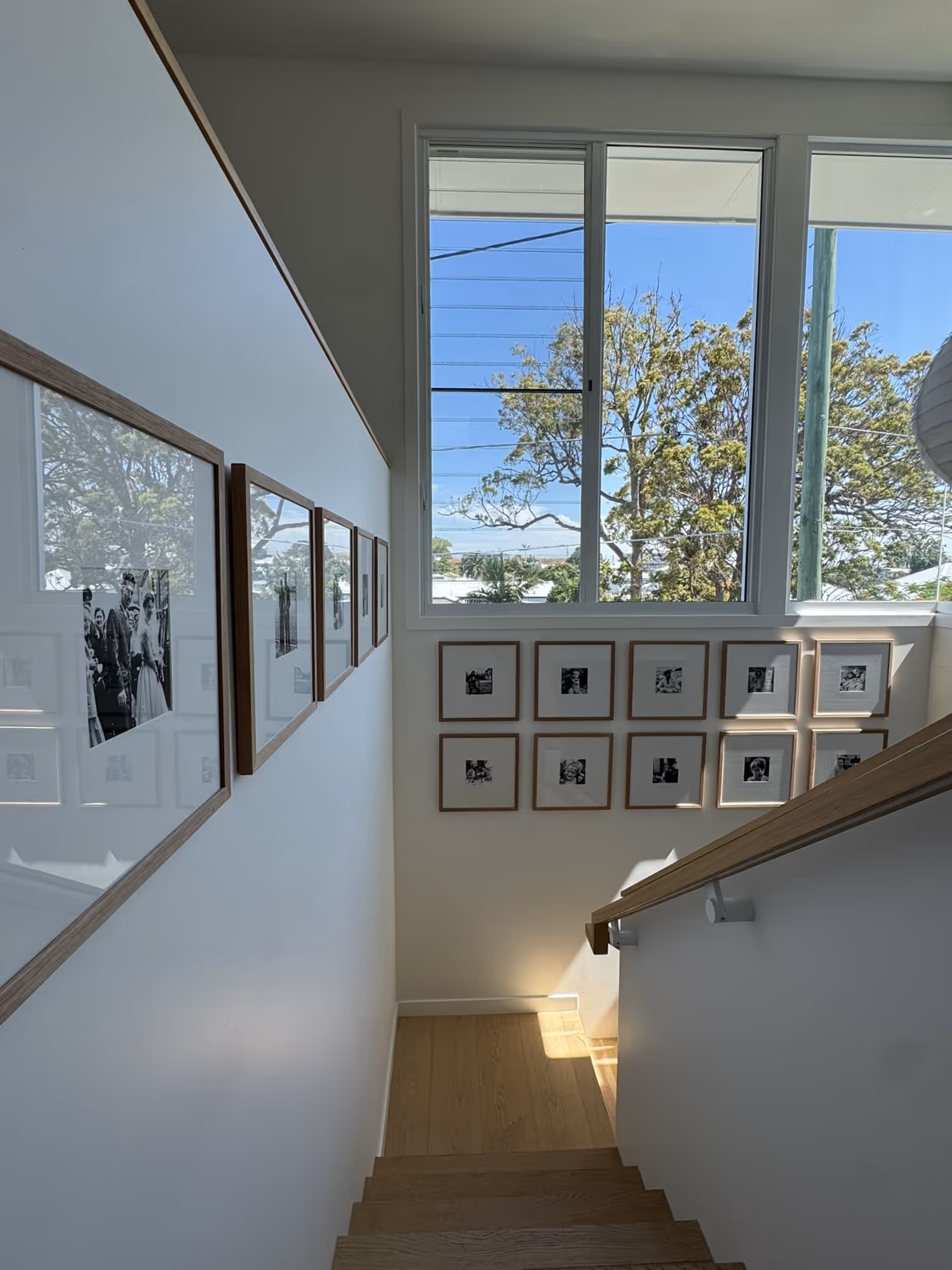 Professional picture hanging in a Brisbane living room