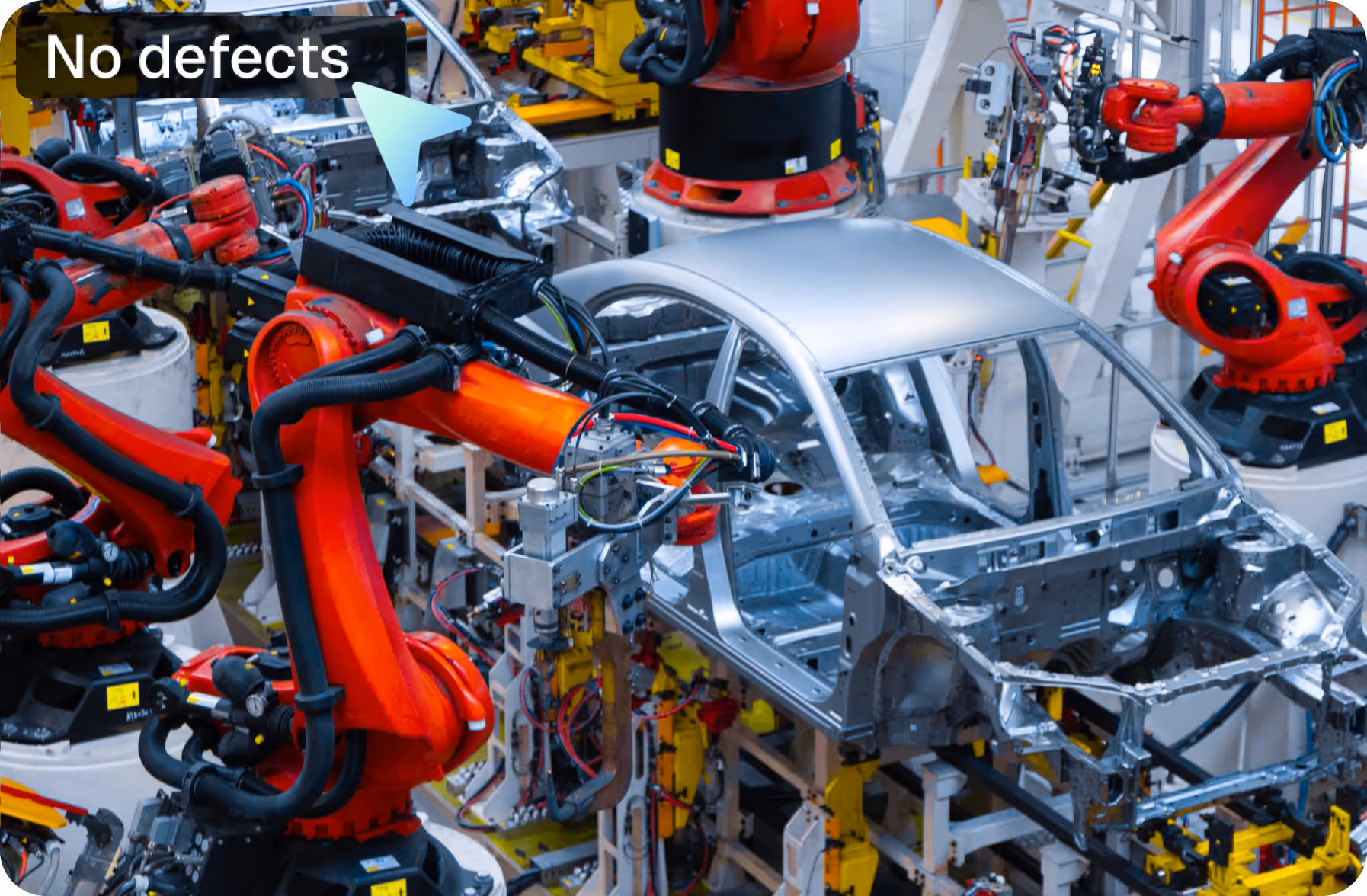 Robotic arms assembling car body frames on an automated automotive production line.