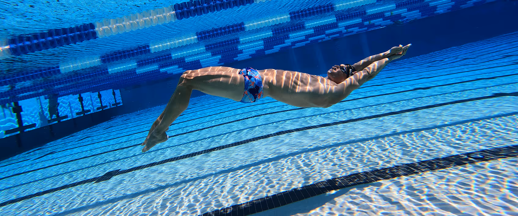 Zach McGinnis swimming underwater