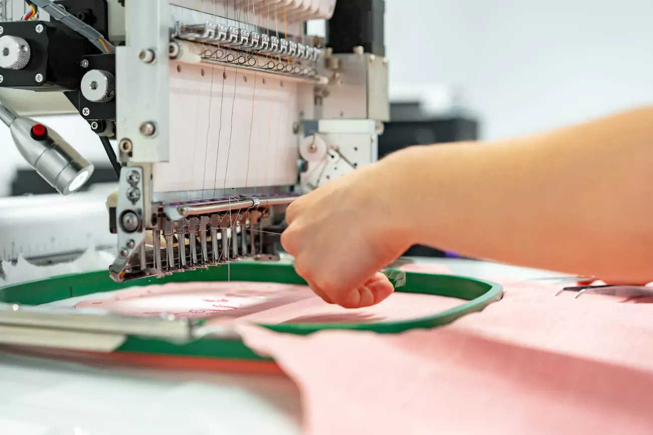 Embroiderer hand stitching