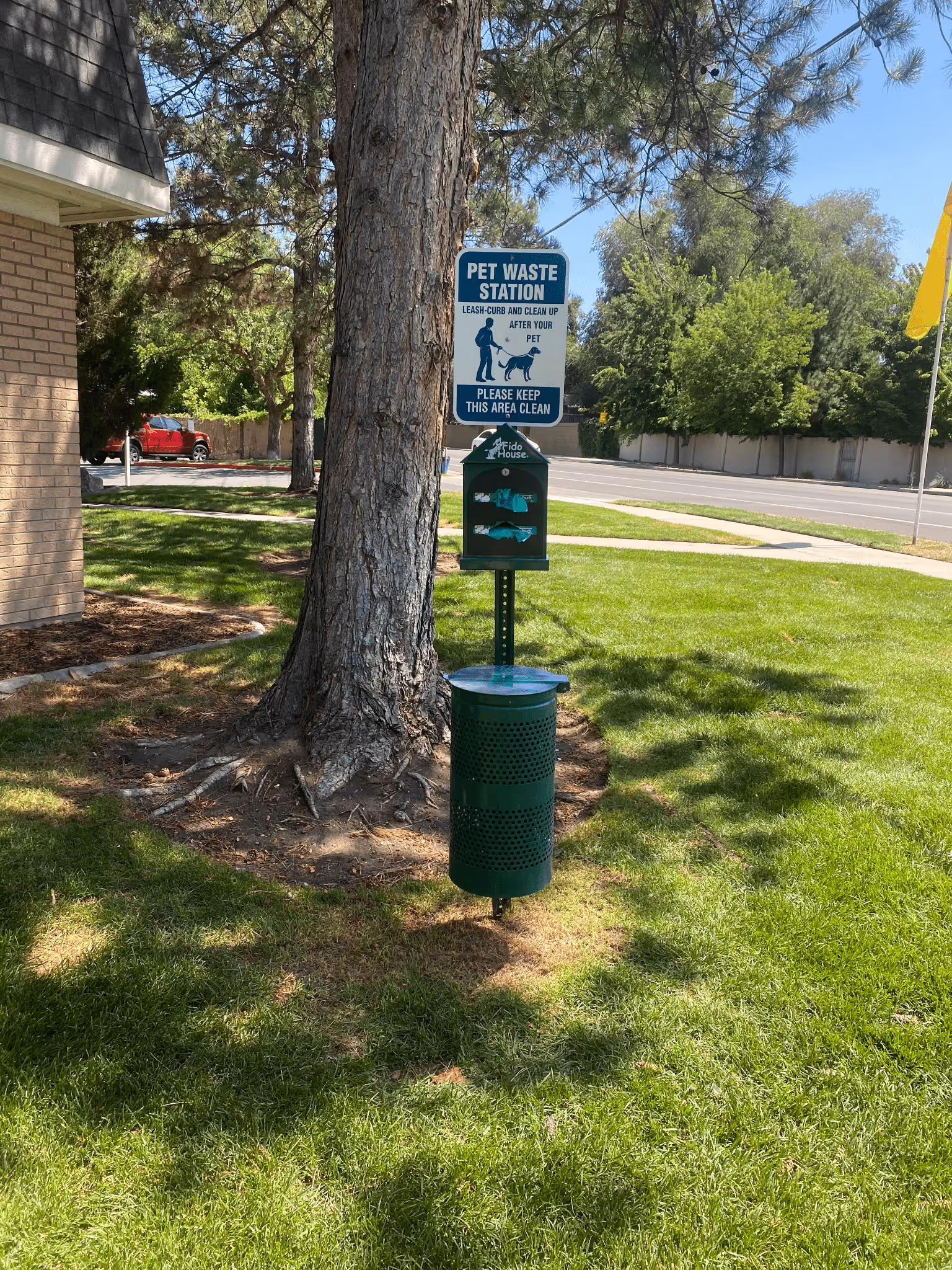 Pet waste station sign at a Utah apartment complex