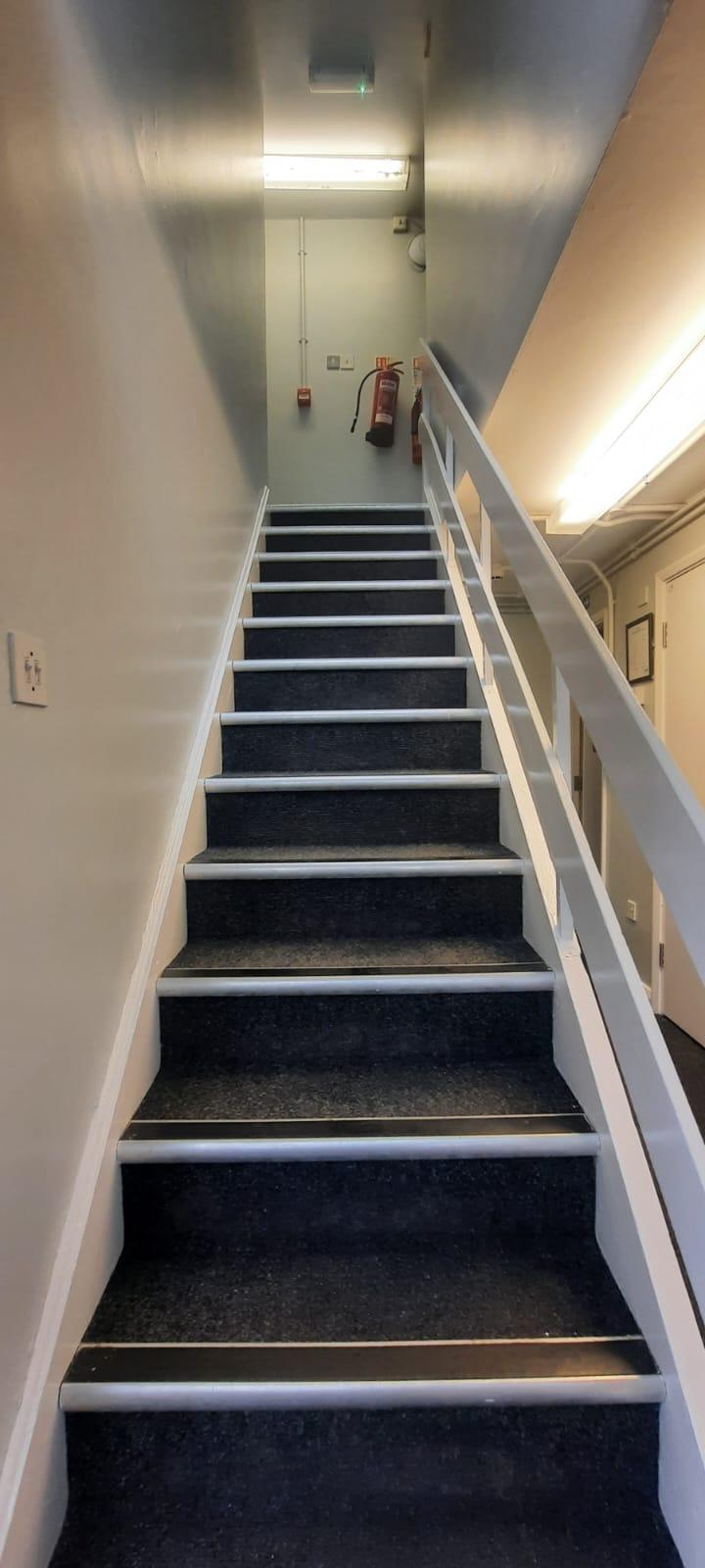 Newly carpeted and decorated staircase in university accommodation