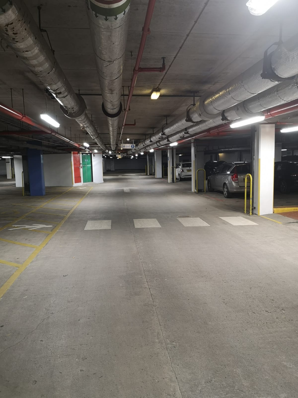 Car park service aisle at Harrogate Conference Centre with painted pillars and markings