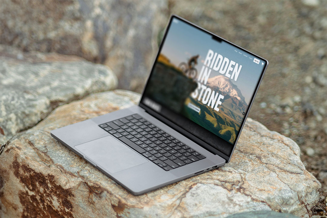 A laptop showing the home page for HInter, tagline, Ridden in Stone