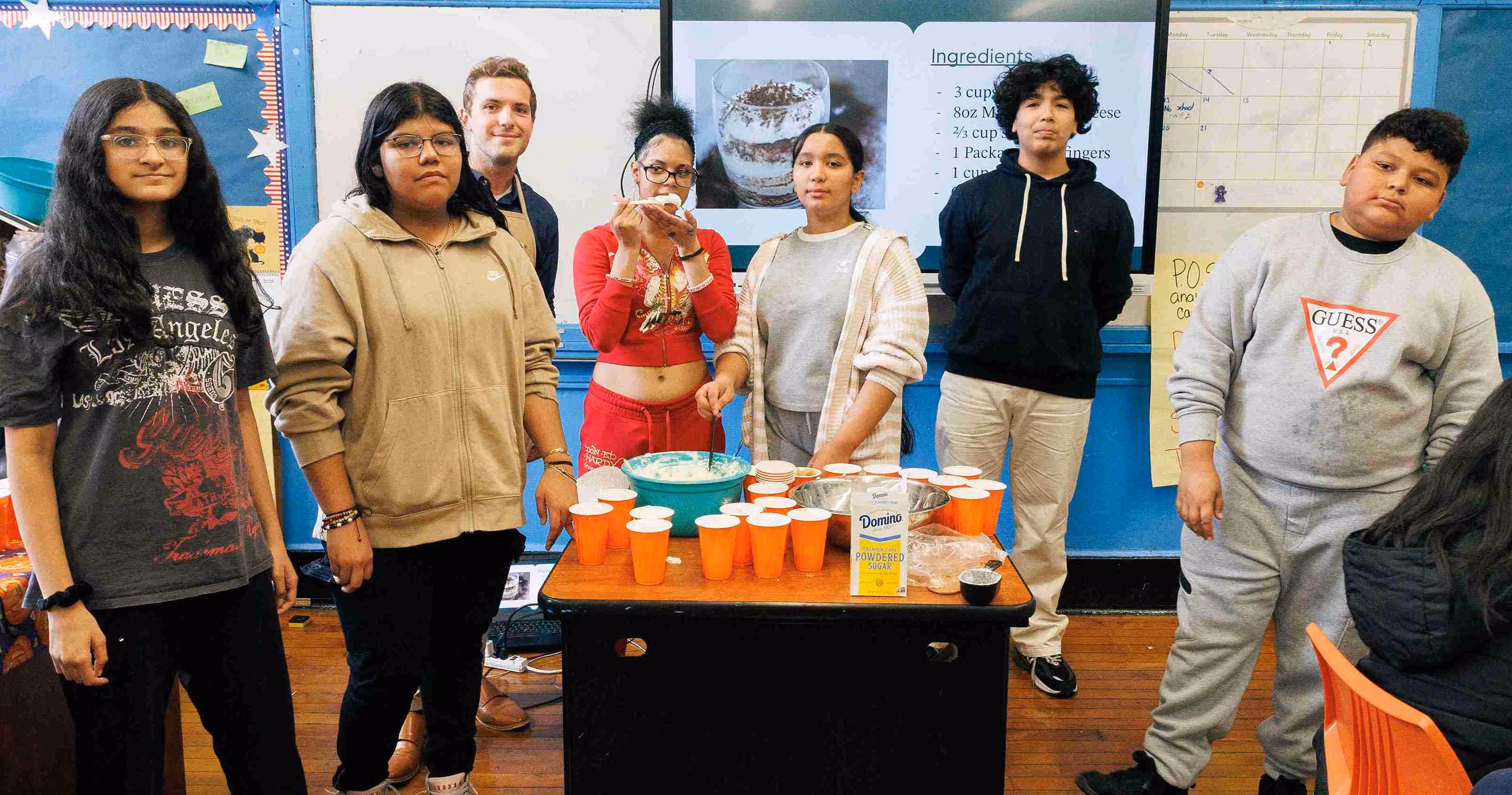 Students present a dessert recipe during a classroom cooking activity