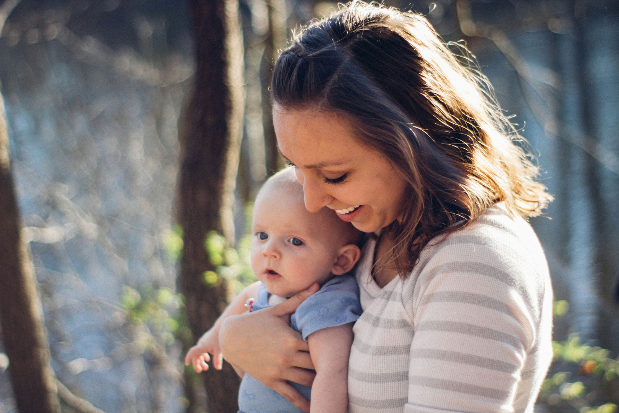 A mom holding a baby.