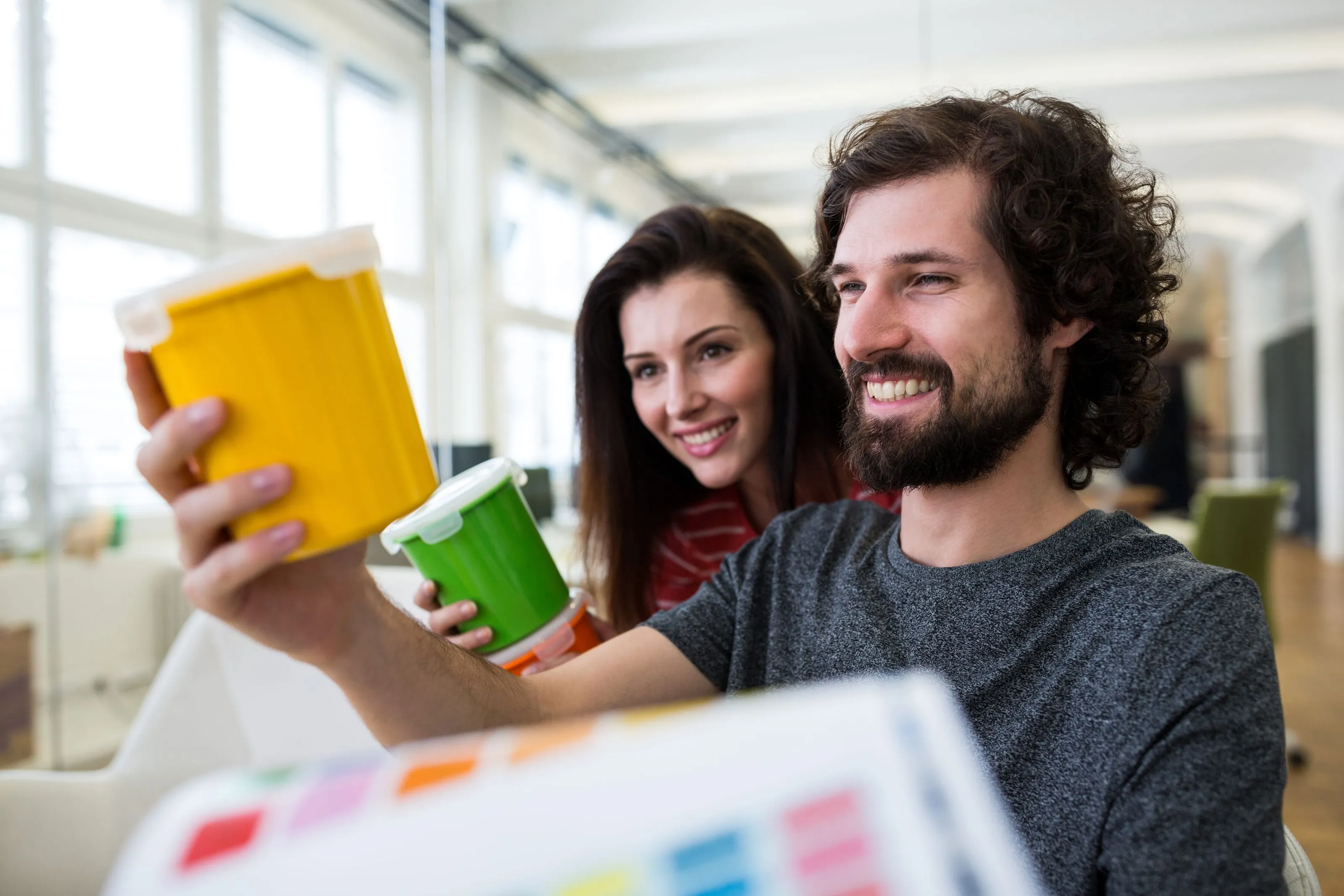 male and female working together in office