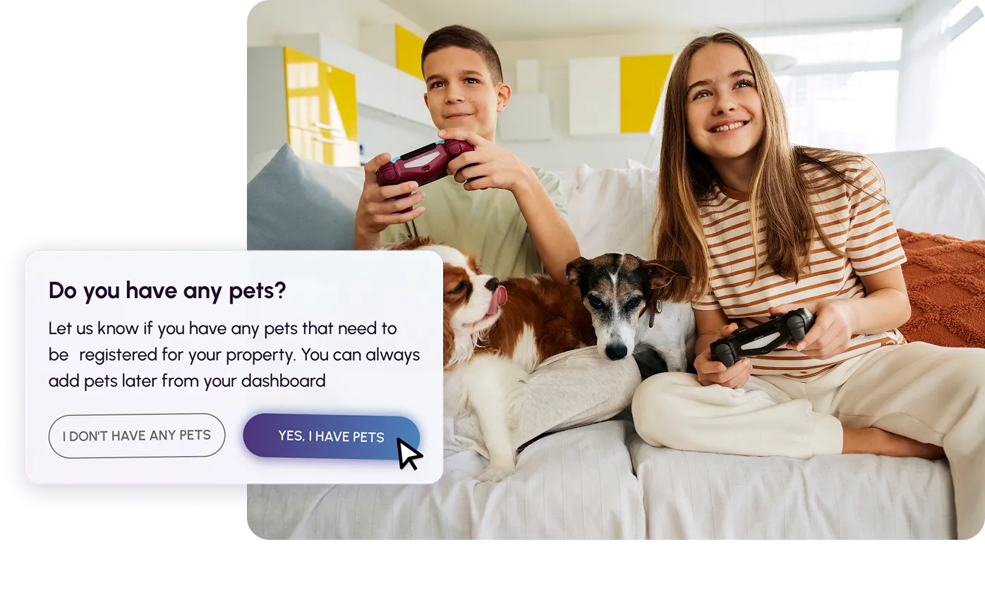 A man kneeling down next to a brown dog.