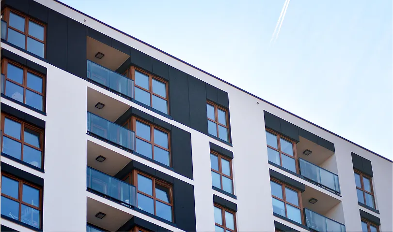Two women sitting at a desk looking at a piece of paper