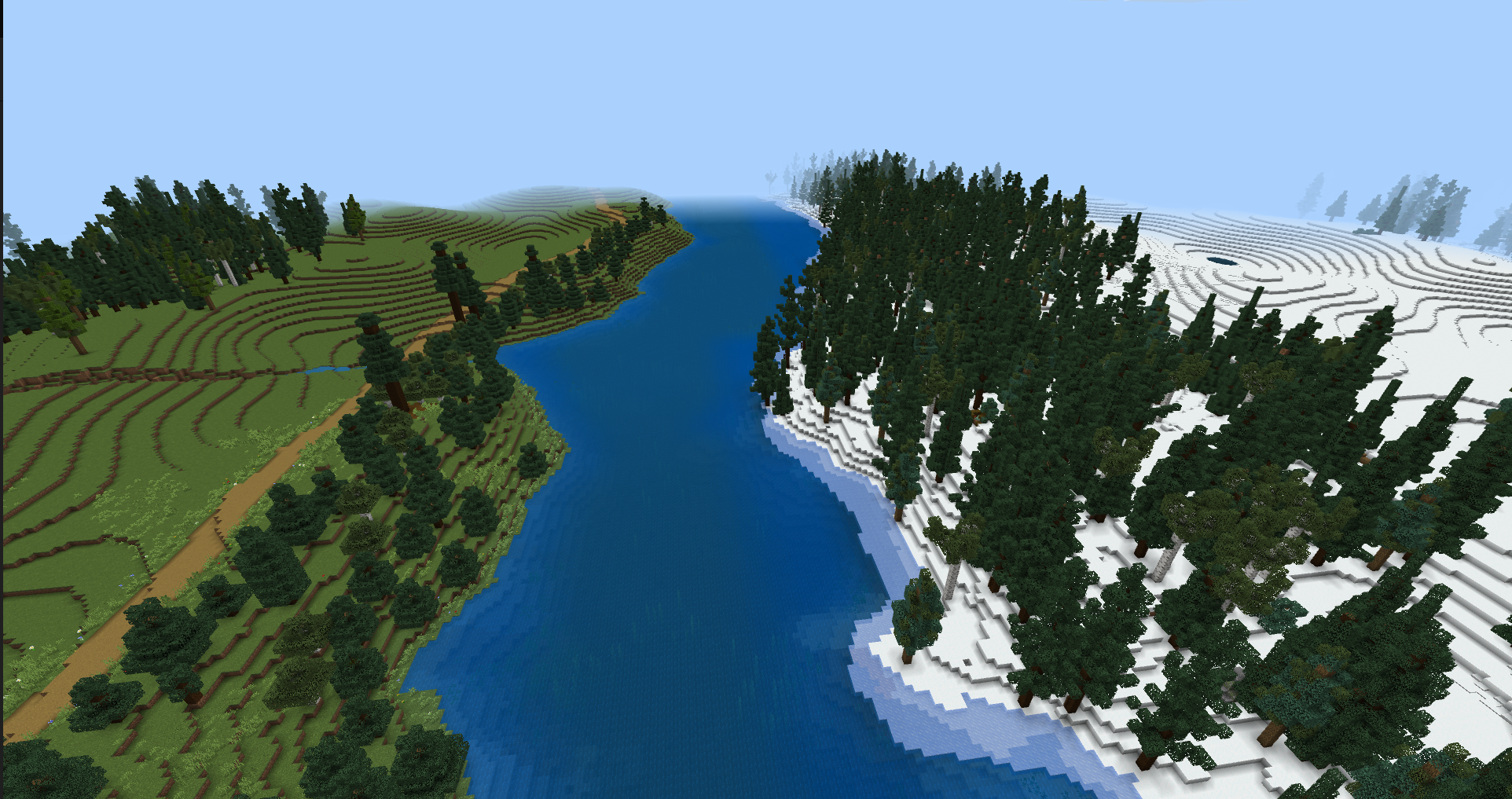 Minecraft landscape showing a river flowing between a green forested hillside and a snowy forest.