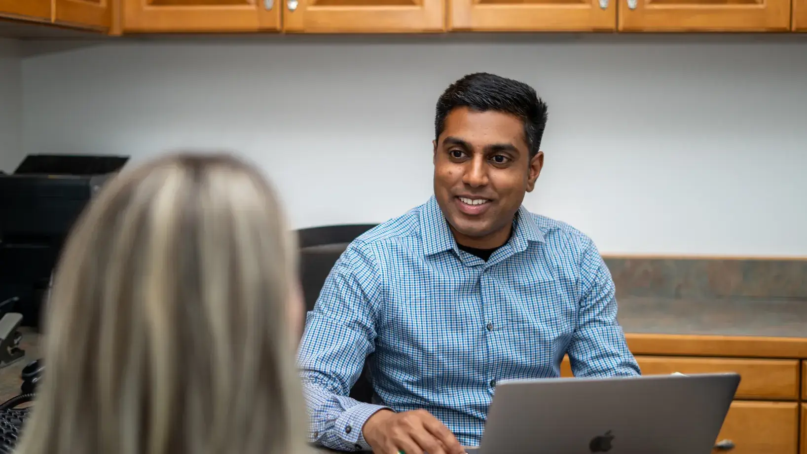 Dr. Patel talking to a patient