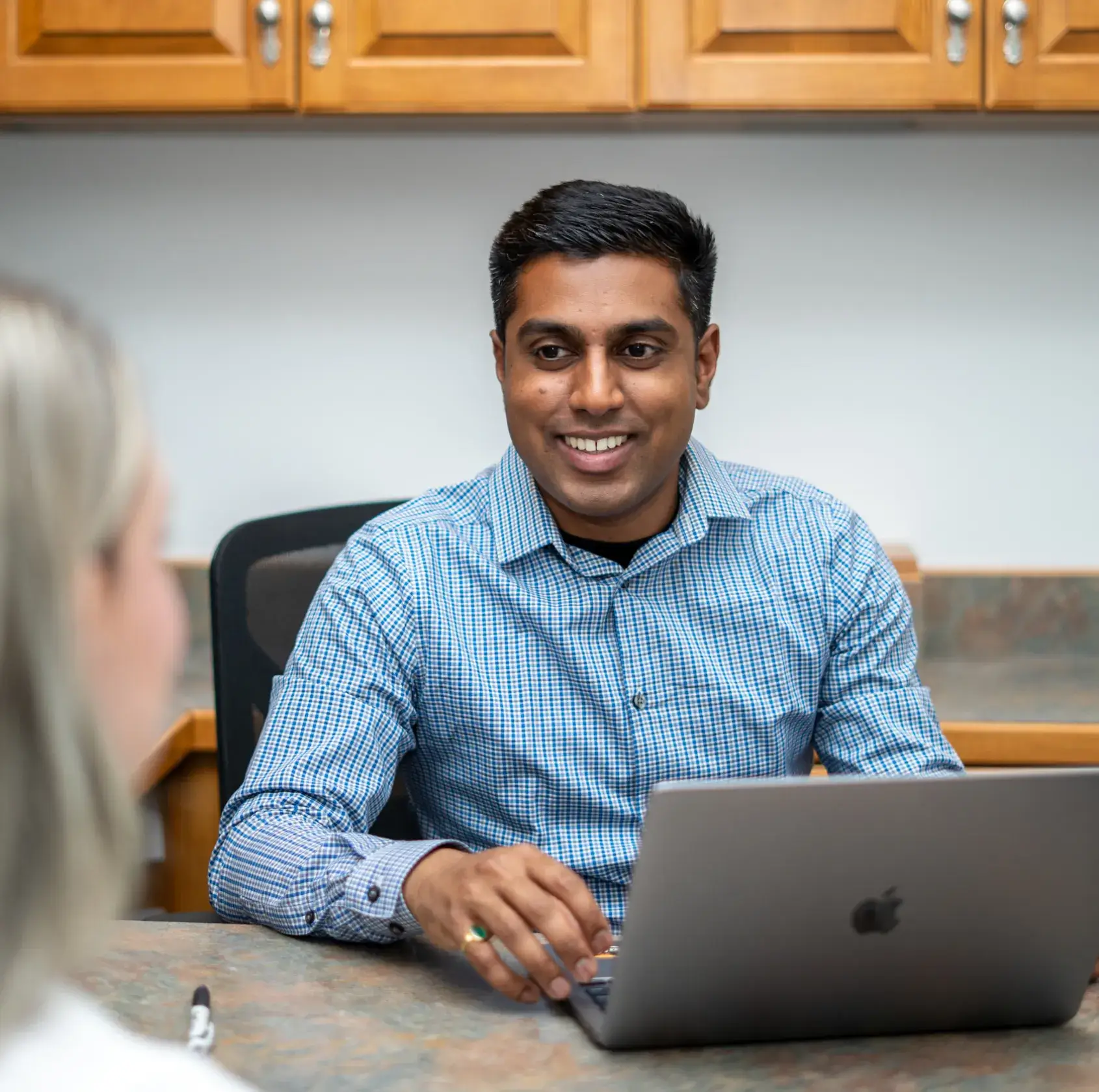 Dr. Patel talking to a patient