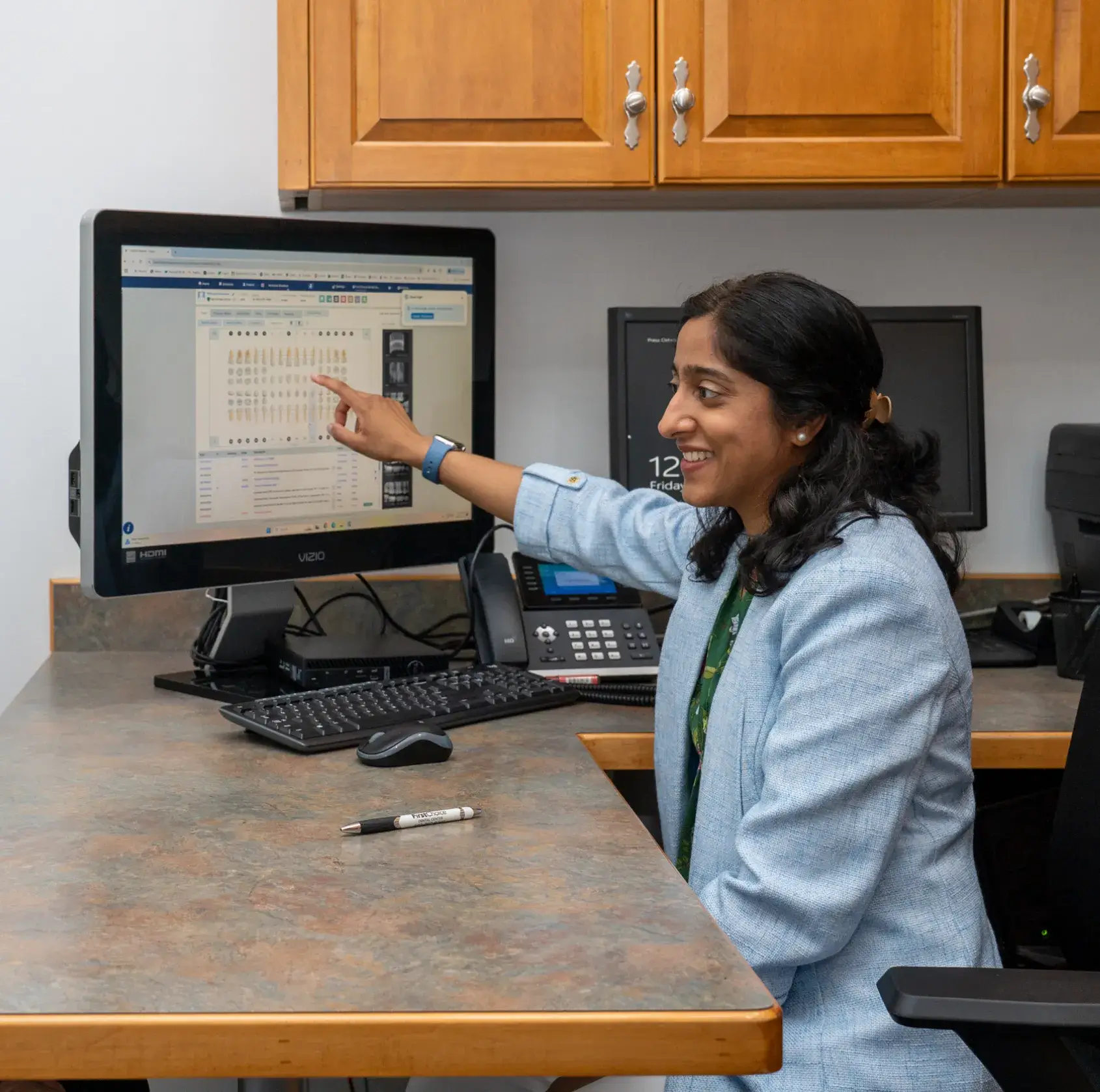 Dr. Patel showing a computer screen