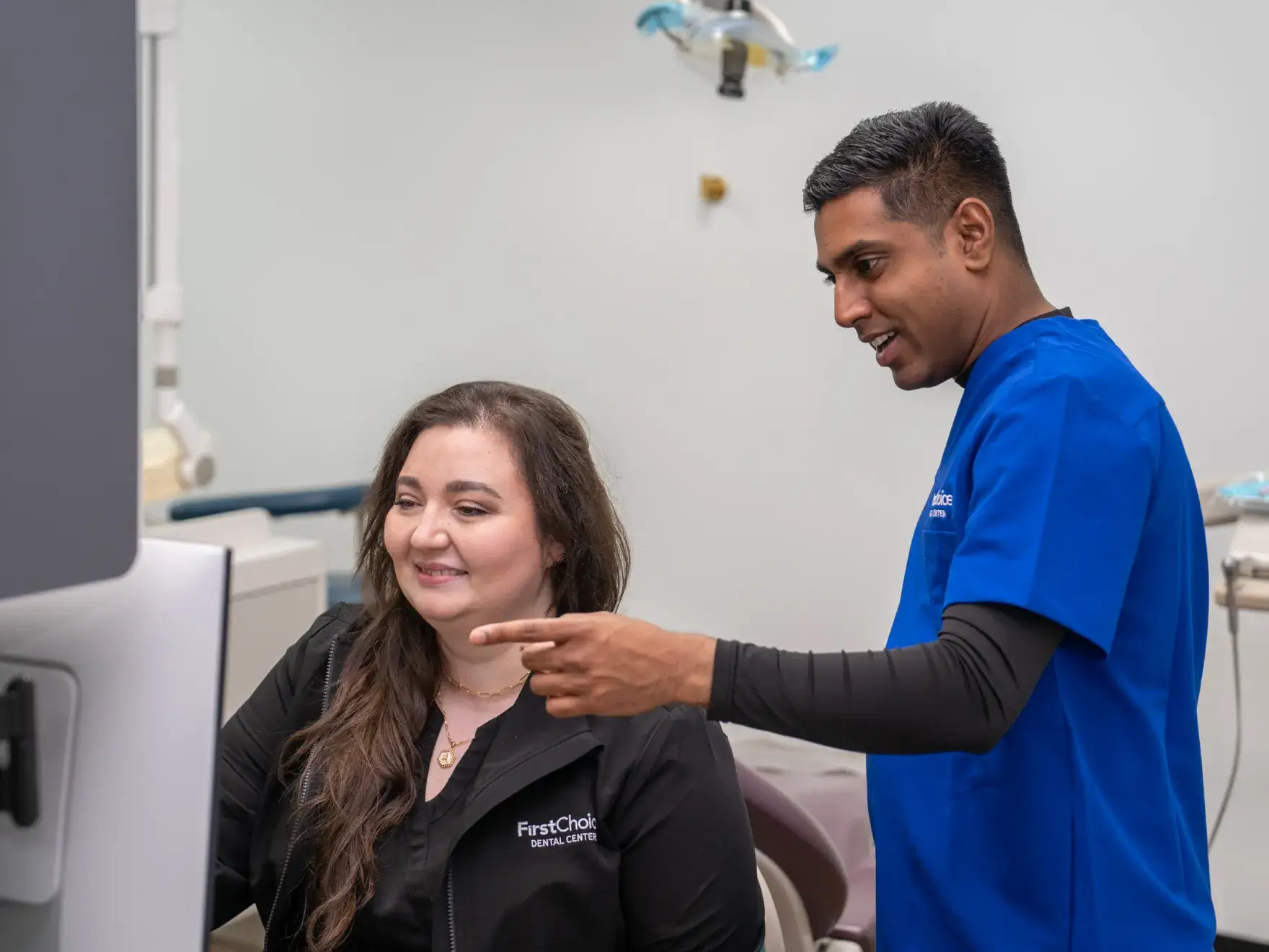 Dr. Patel talking to a team member
