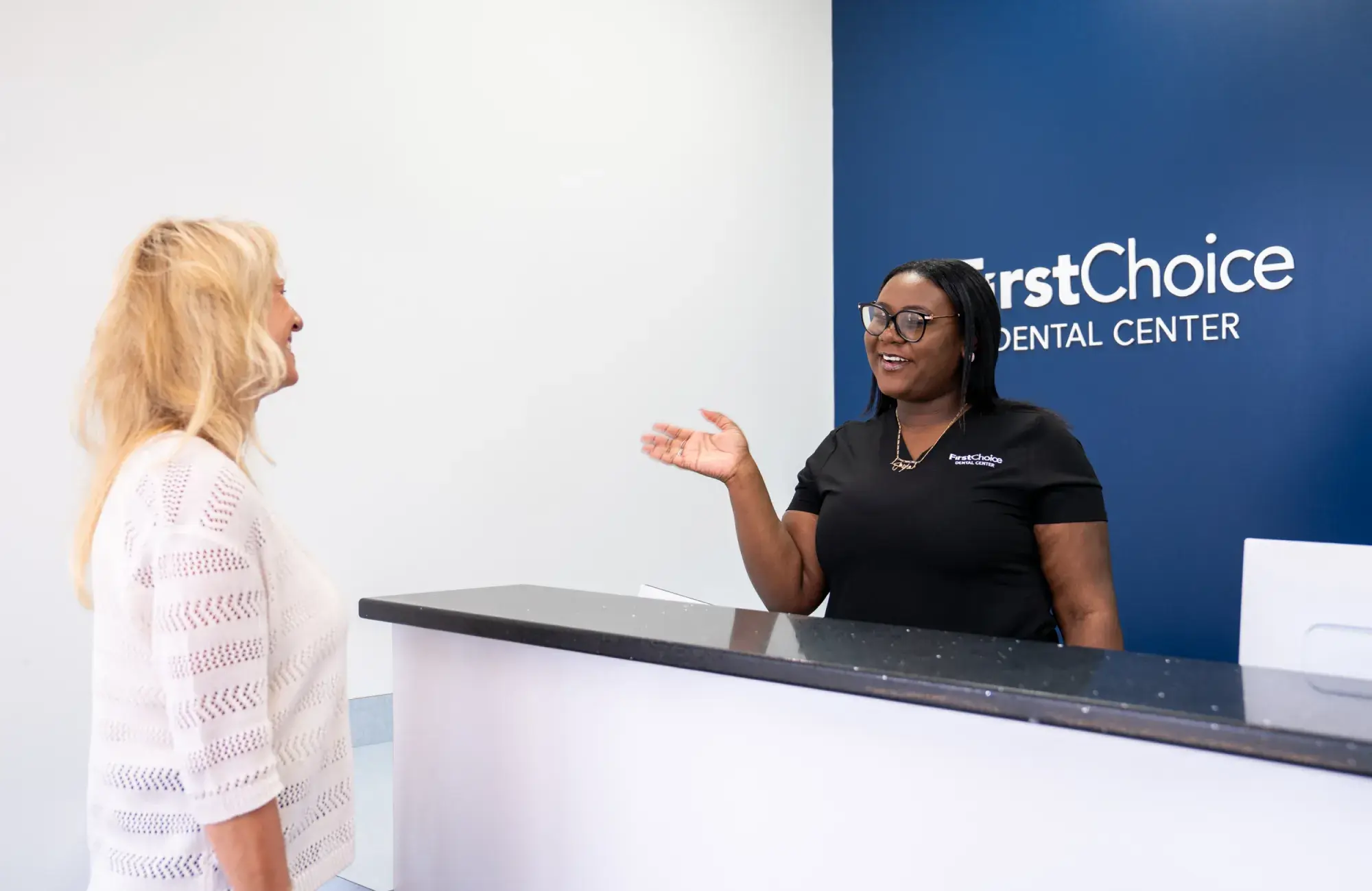 Patient and team member at the front desk