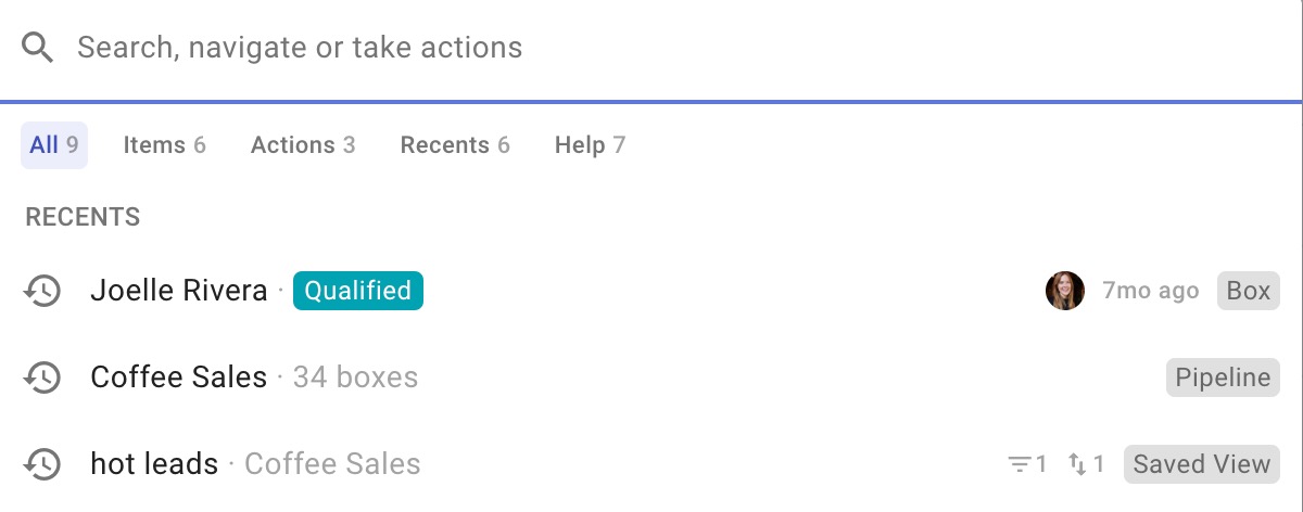 A user interface of a task management or CRM application showing a search bar. Below are recent items: "Joelle Rivera - Qualified," "Coffee Sales - 34 boxes," and "hot leads - Coffee Sales." Tags like "Box," "Pipeline," and "Saved View" are visible.