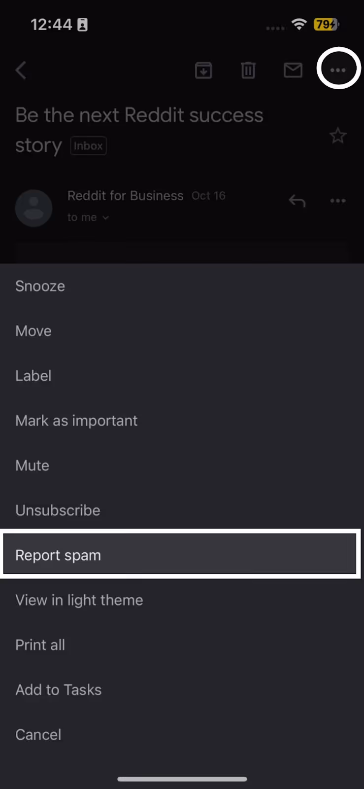 A screenshot of Gmail email thread on dark mode in mobile device displaying the More menu with the "Report spam" function