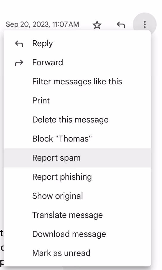 A screenshot of the drop down menu/ More menu in the email thread where you can see the "Report spam" function