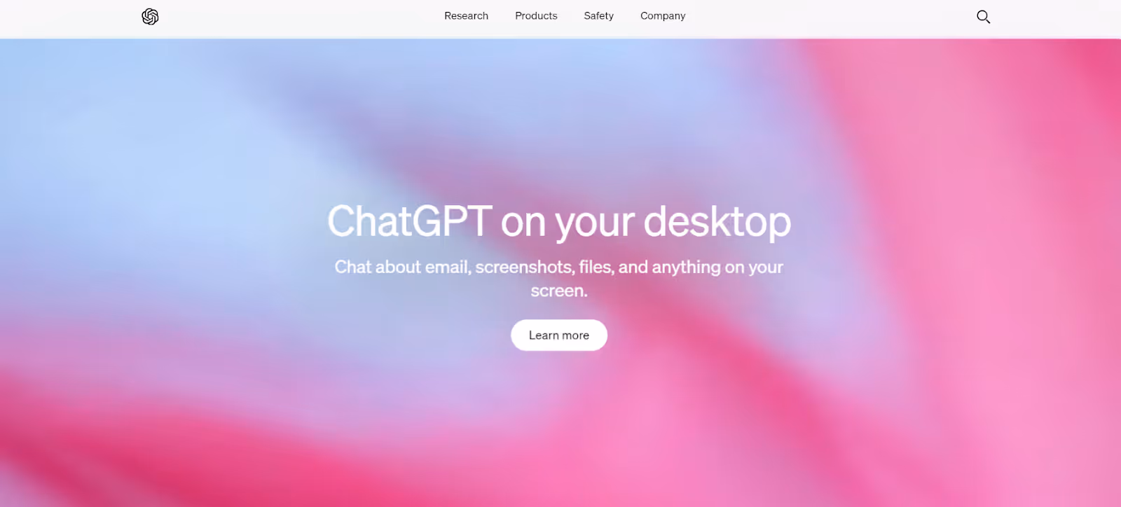 A webpage shows a blurred pink and blue background with center text: "ChatGPT on your desktop. Chat about email, screenshots, files, and anything on your screen." Below this text, there's a "Learn more" button. The top menu options read: Research, Products, Safety, Company.