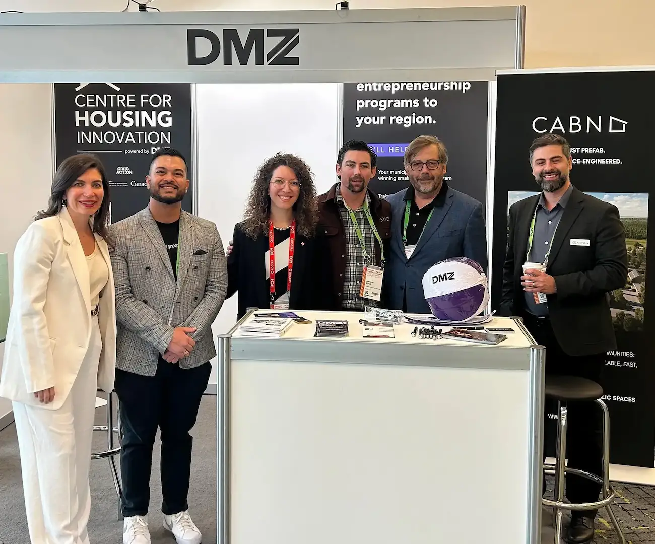 Photo of CHI booth with staff and members