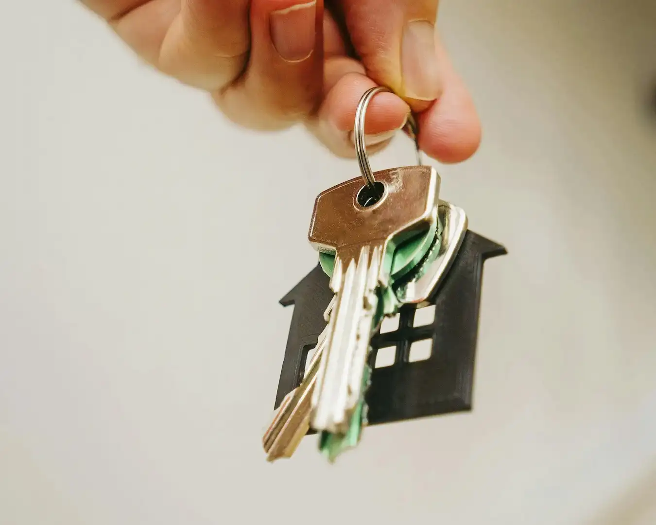 Hand holding a set of keys